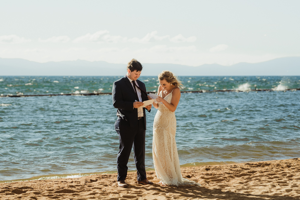 Lake Tahoe Elopement, photo of couple reading love notes by the lake