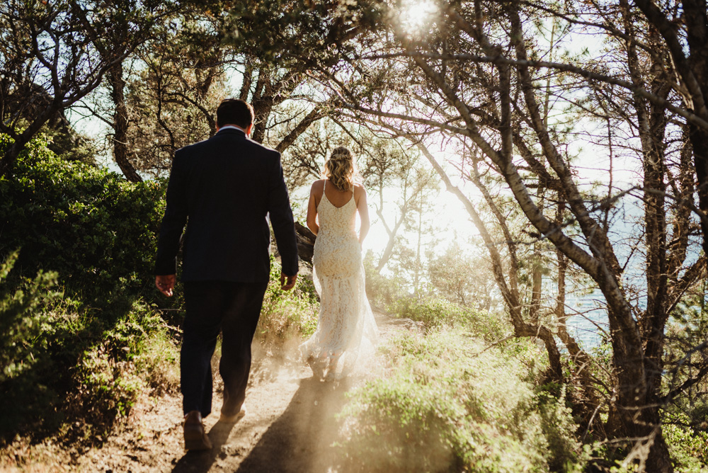 Lake Tahoe Elopement, photo of couple surrounded by sun and dustLake Tahoe Elopement, photo of couple walking down a trailLake Tahoe Elopement, photo of couple walking on a trail 