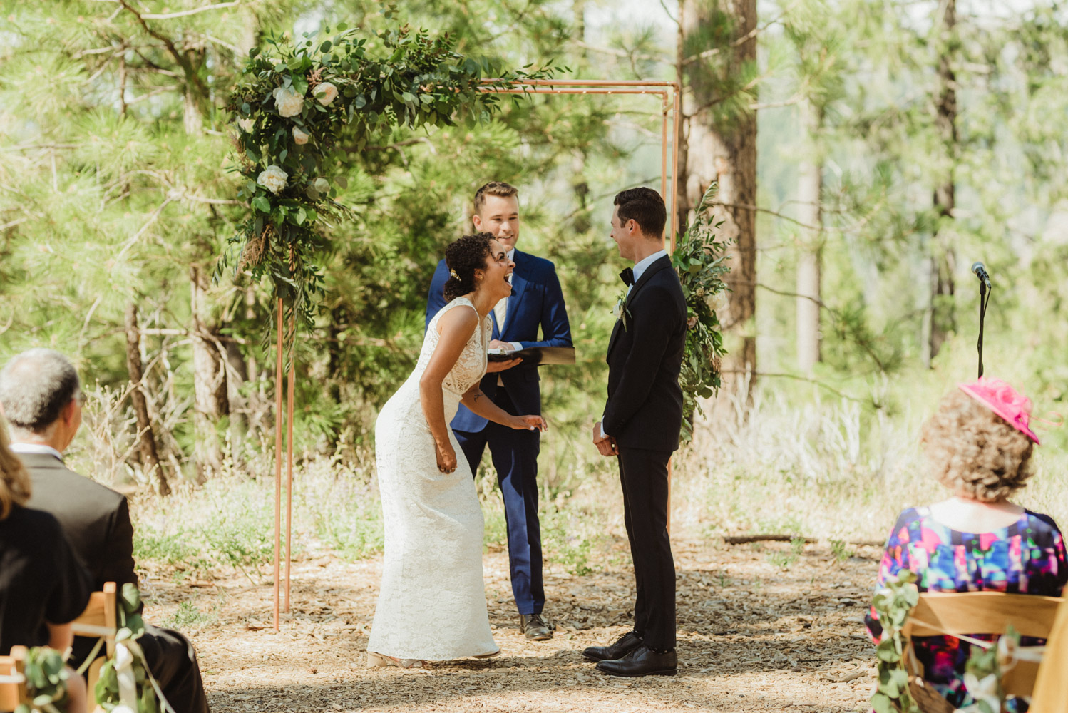 Rush Creek Lodge Wedding, photo of couple laughing during their ceremony 