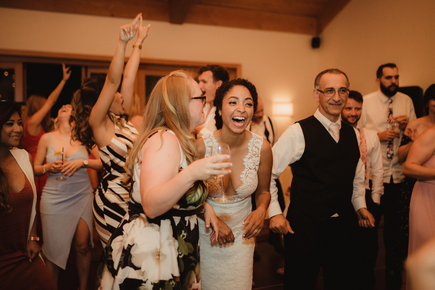 Rush Creek Lodge wedding, bride laughing on the dance floor photo