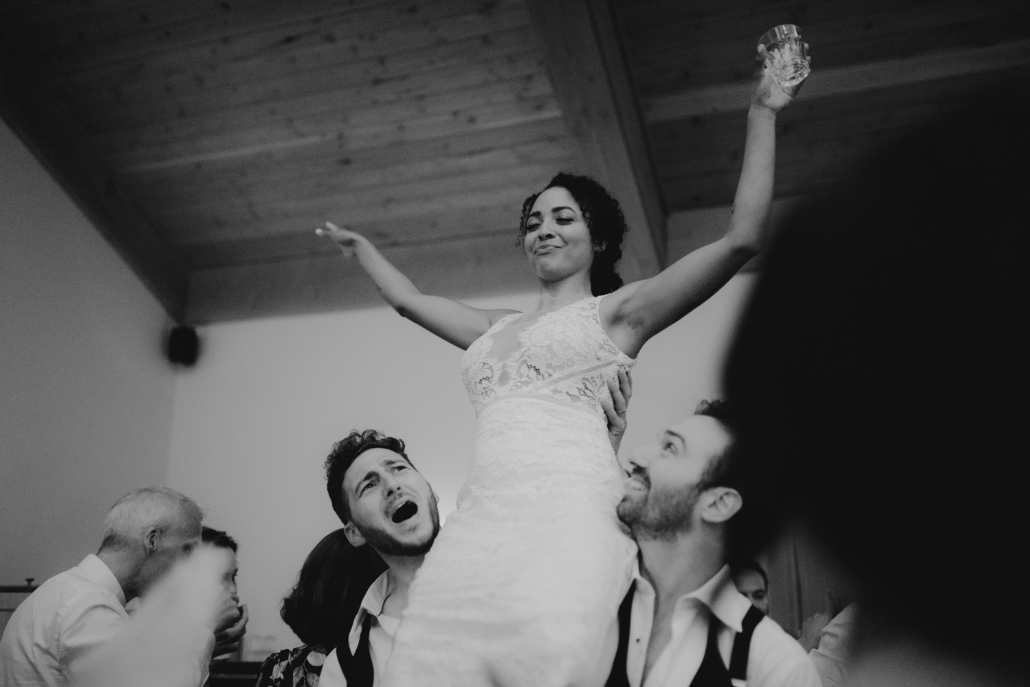 Rush Creek Lodge wedding, bride being raised in the air photo
