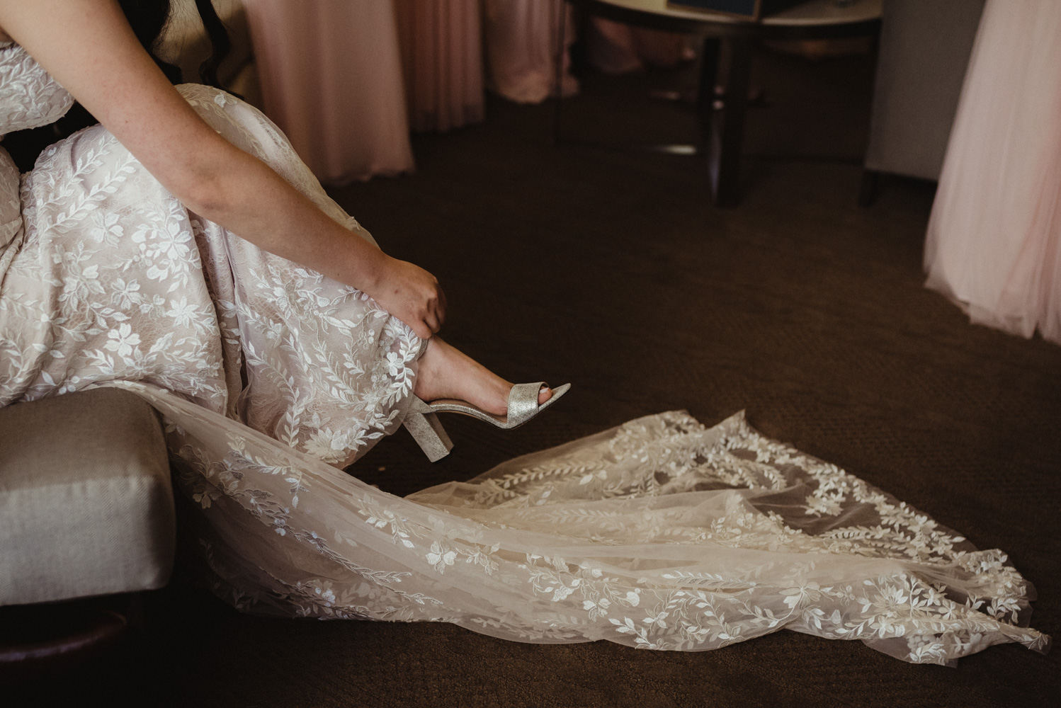 Hellman-Erman Mansion Wedding, photo of bride putting on her heals