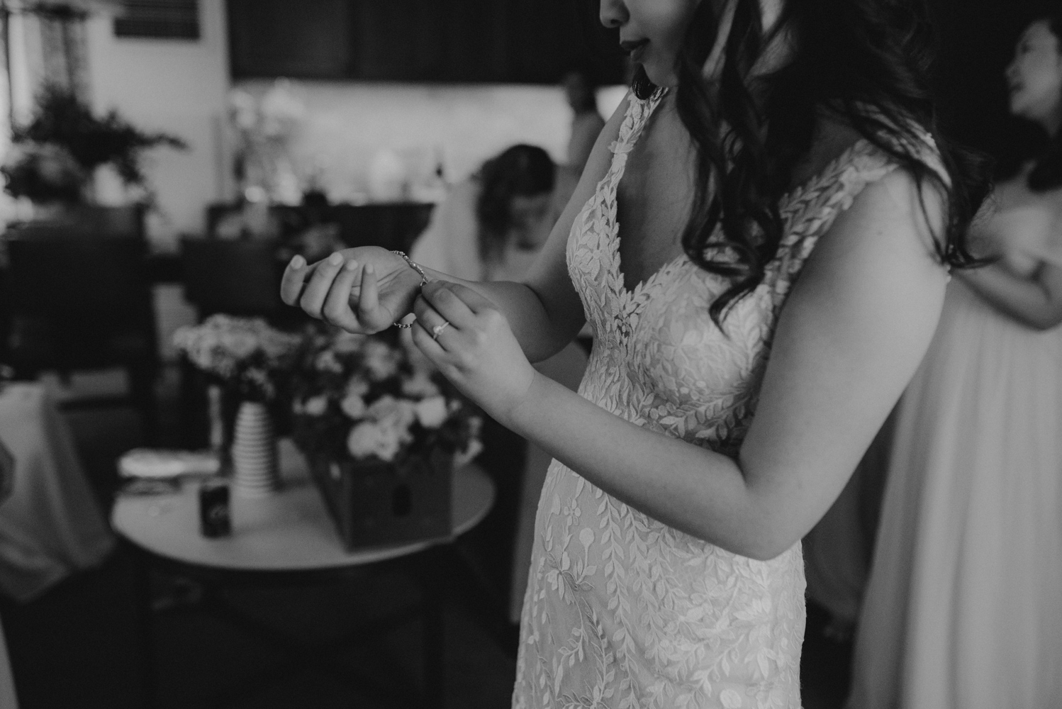 Hellman-Erman Mansion Wedding, photo of bride putting on her bracelet 