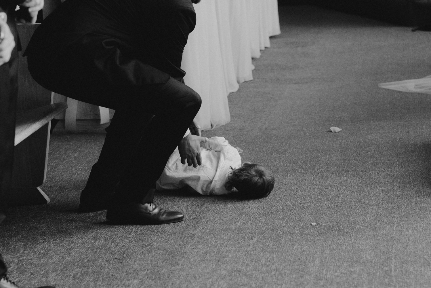 Hellman-Erman Mansion Wedding, photo of kid crying in a catholic church