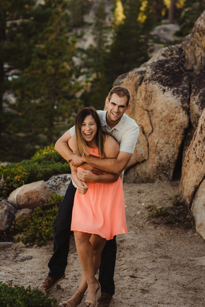 Lake Tahoe Wedding Photographer, photo of couple hugging and lauding on a trail at Donner Pass