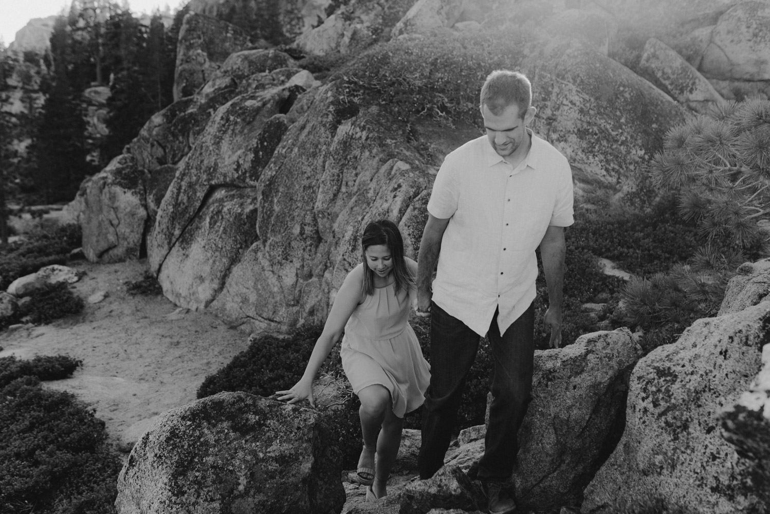 Lake Tahoe Wedding Photographer, photo of couple holding hands walking up granite features 