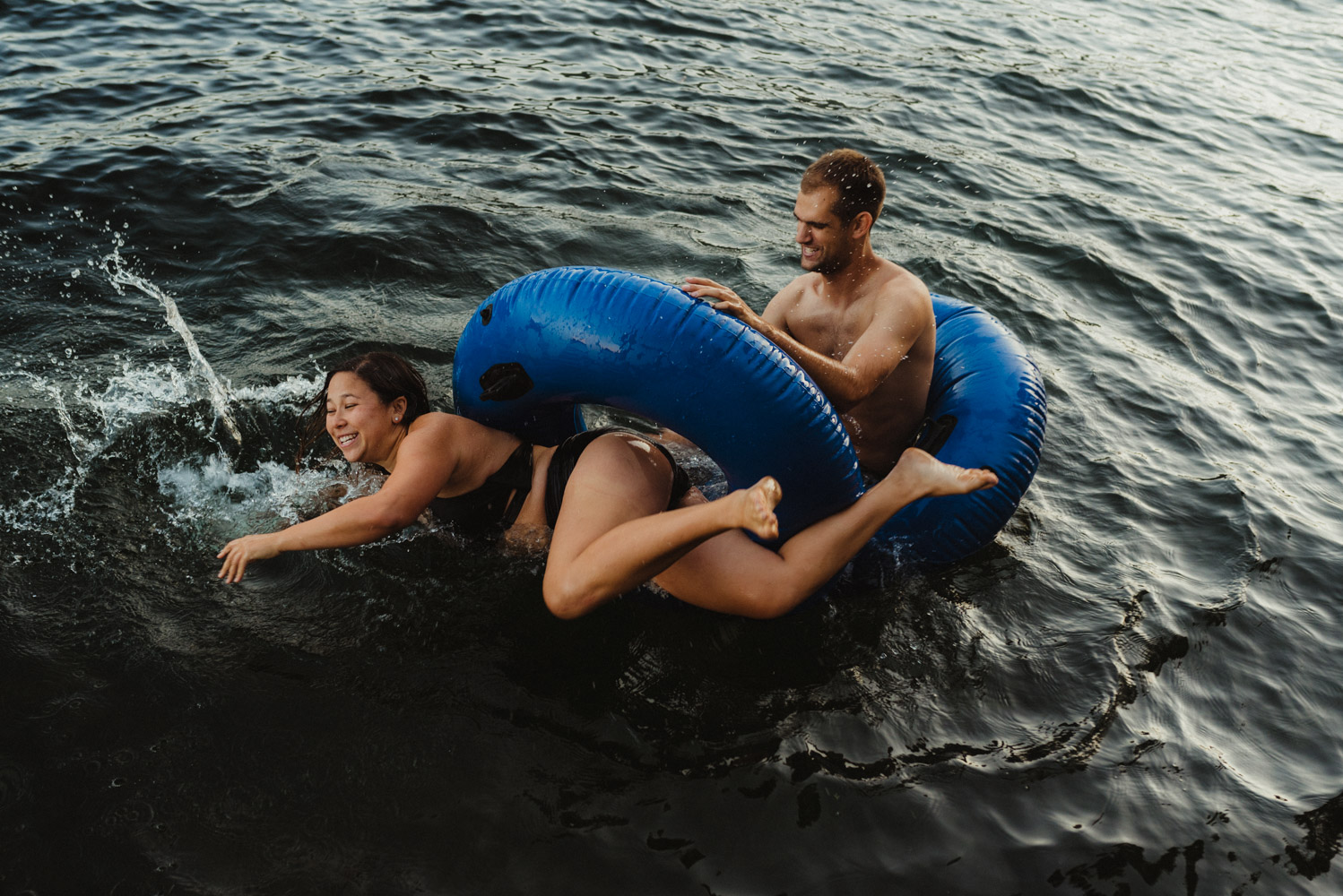 Lake Tahoe Wedding Photographer, photo of couple in water tubes in the lake