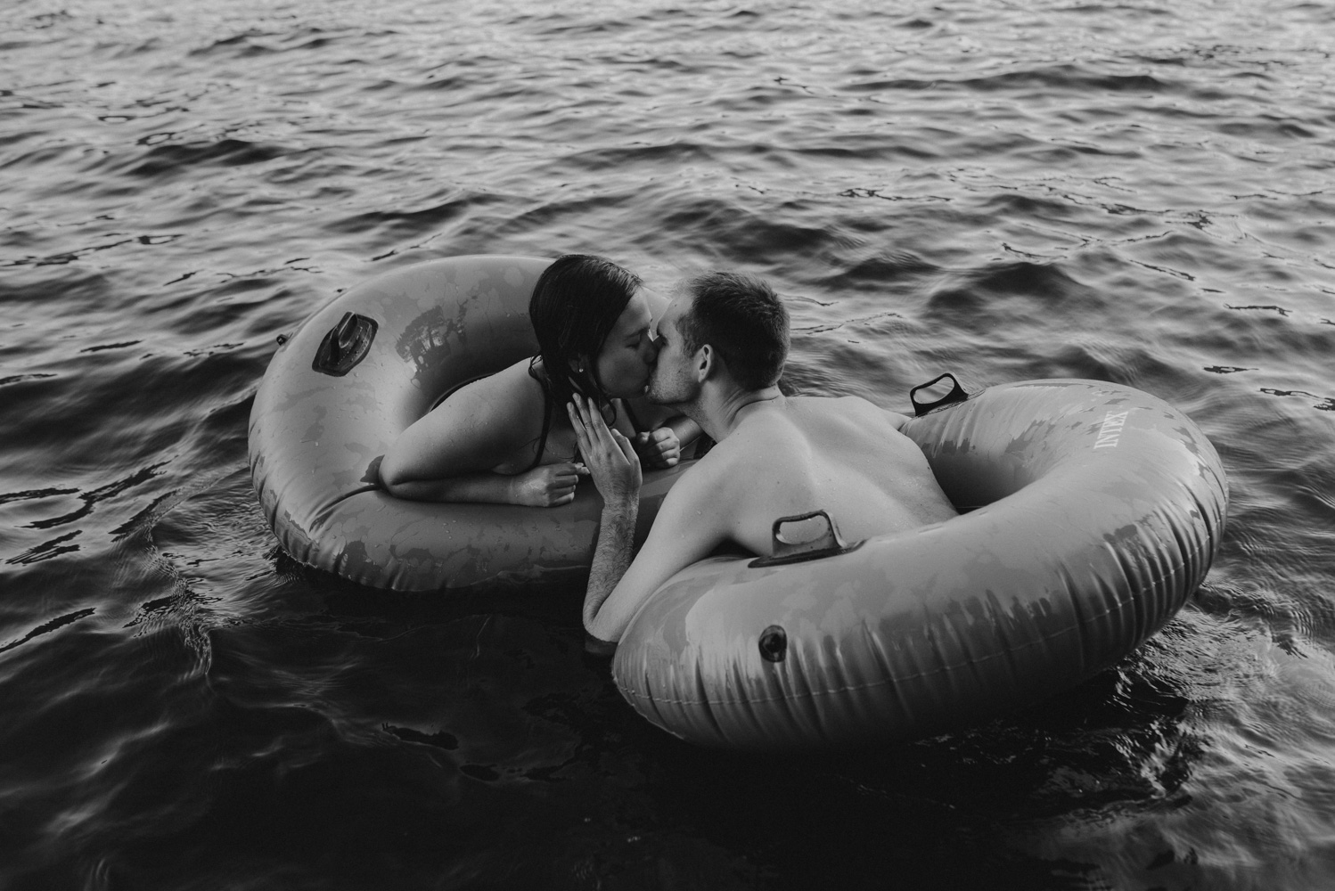 Lake Tahoe Wedding Photographer, photo of couple kissing in their tubes