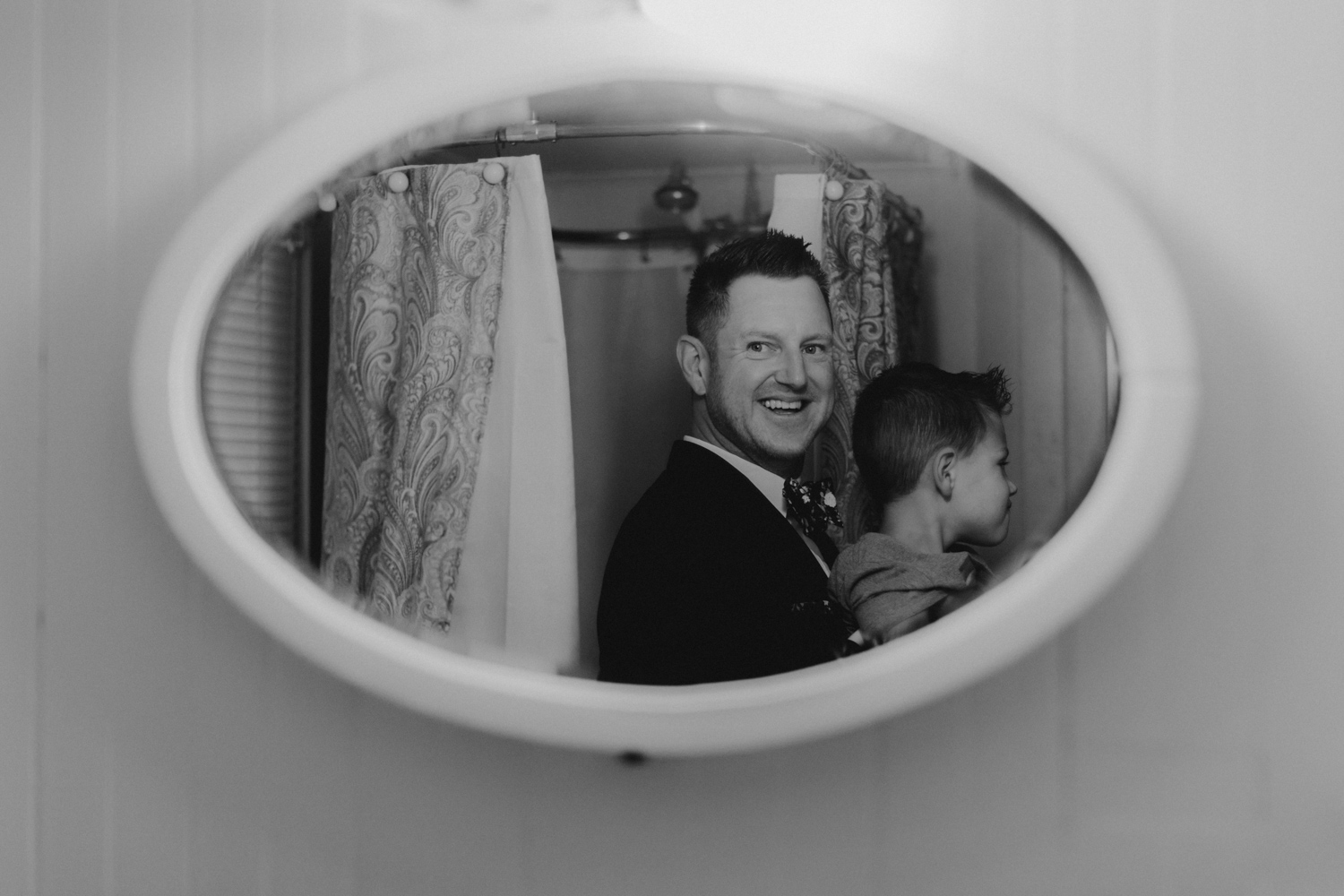 Twenty Mile House Wedding Photographer,  groom seeing himself in the mirror 