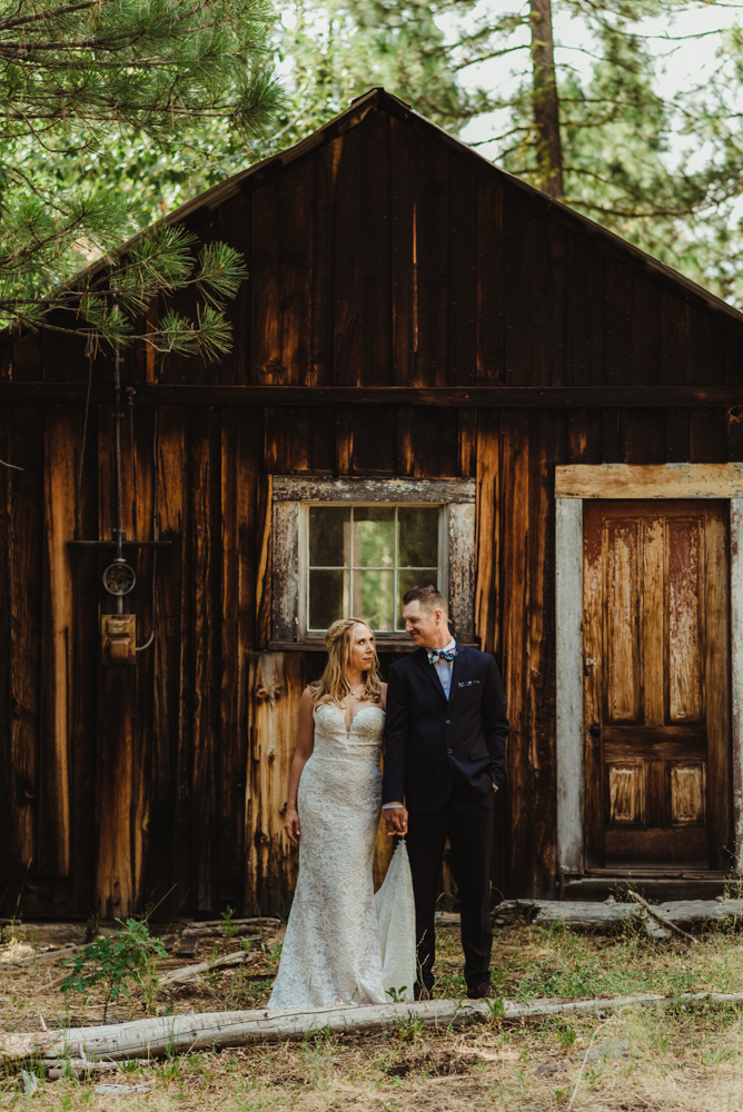 Twenty Mile House Wedding Photographer, couples photo in front of an old mining home