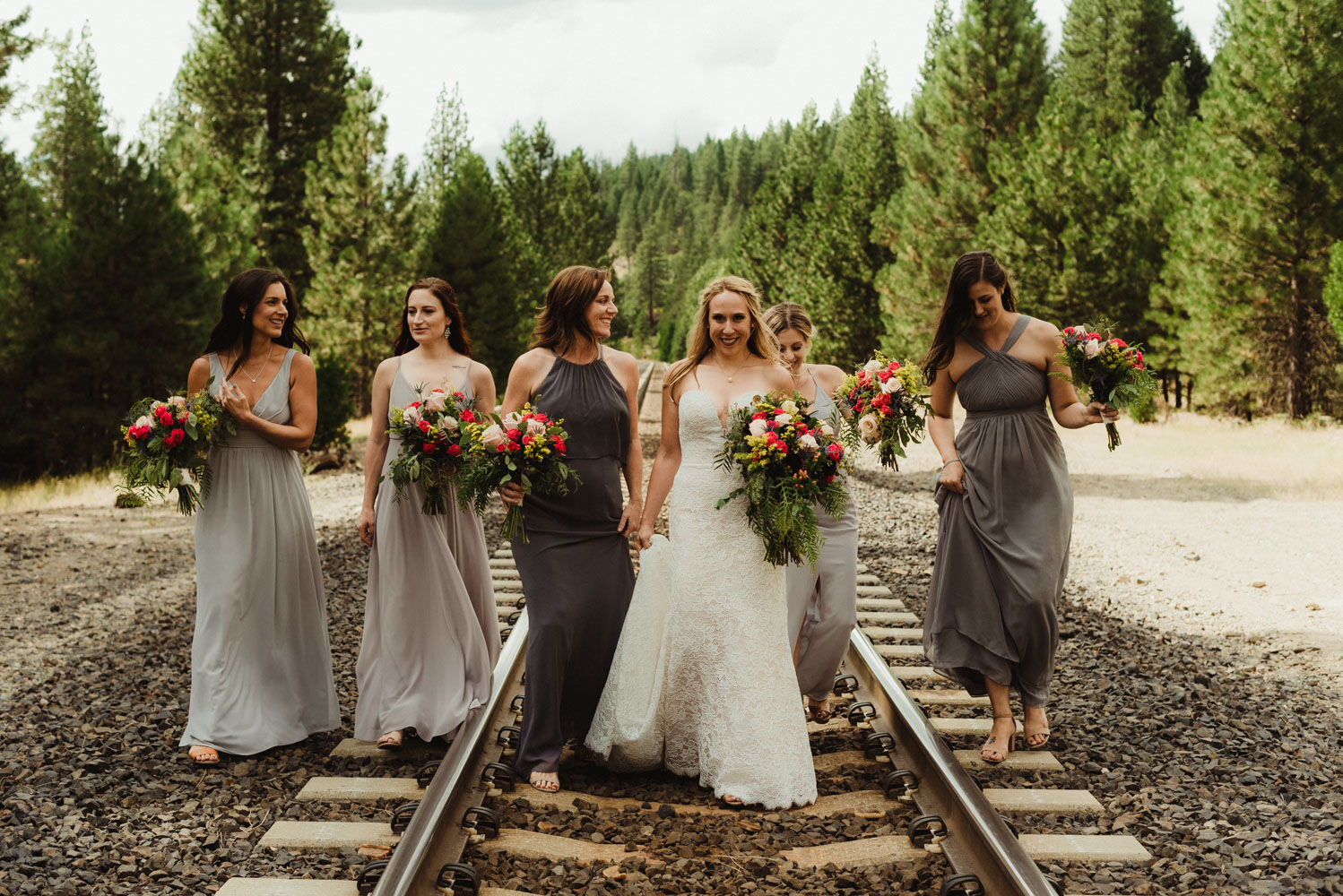 Twenty Mile House Wedding Photographer, photo of bridesmaids and bride on a train track