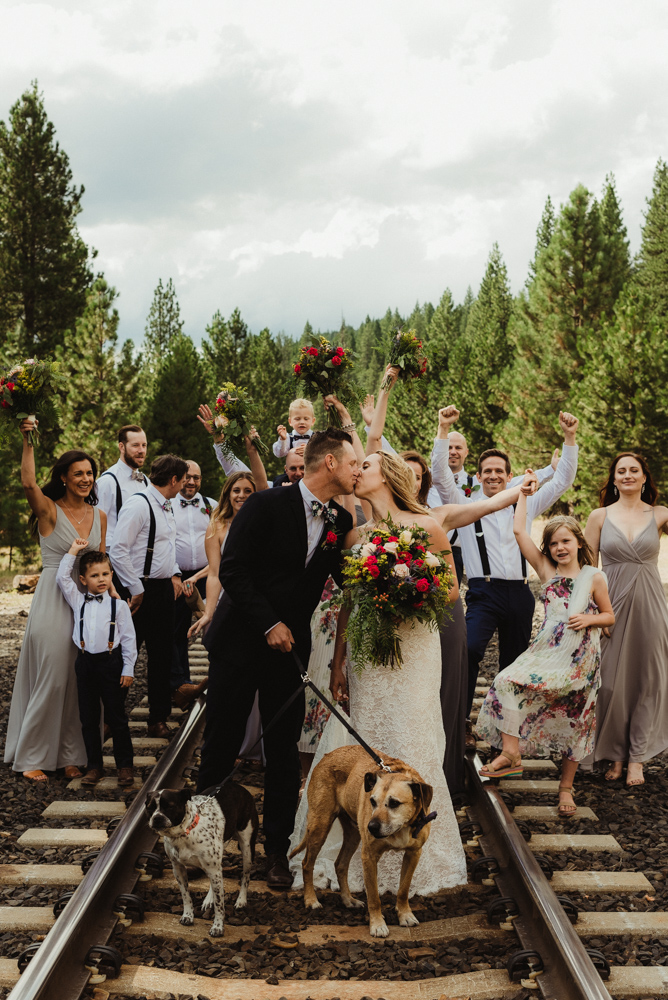 Twenty Mile House Wedding Photographer, photo of couple and bridal party on the train tracks