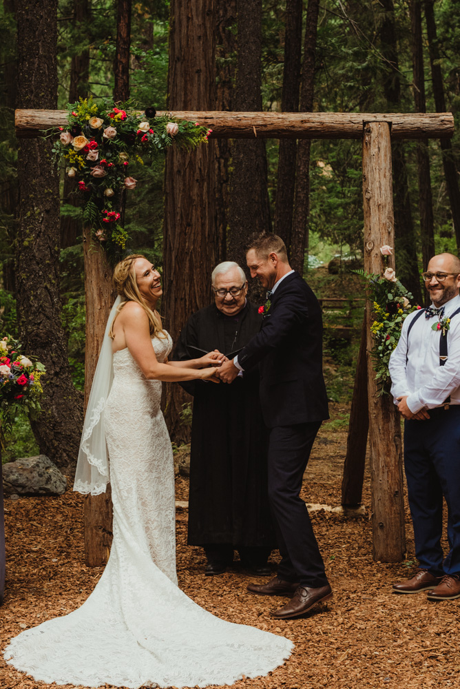 Twenty Mile House Wedding Photographer, bride laughing during the ceremony 