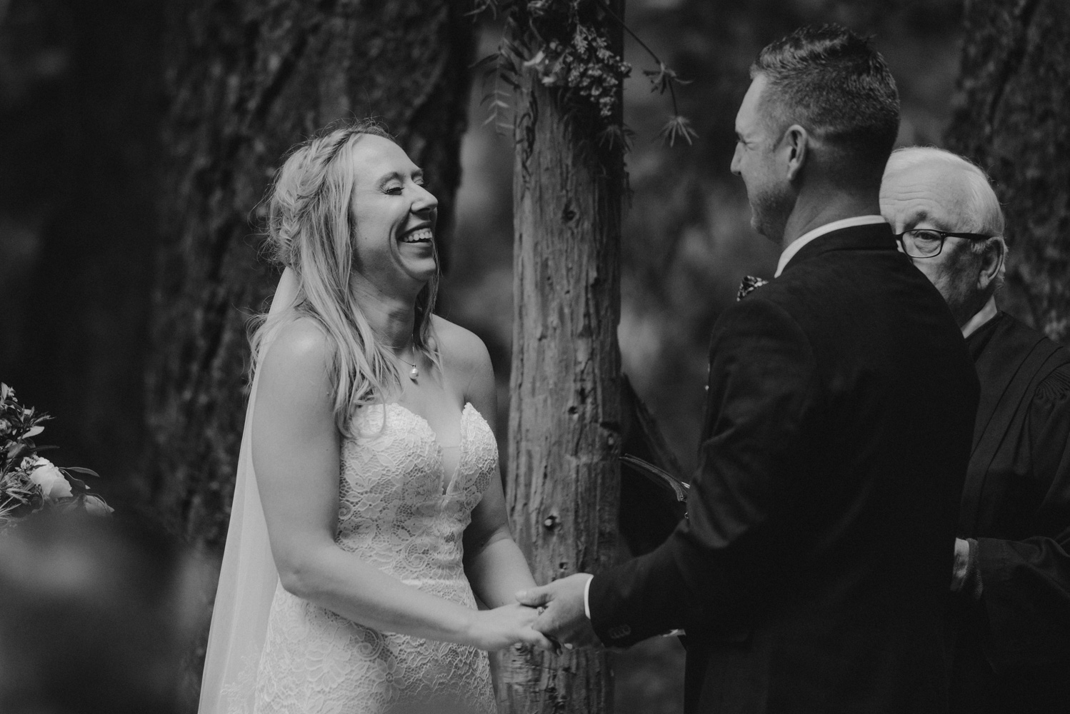Twenty Mile House Wedding Photographer, bride laughing during her ceremony  