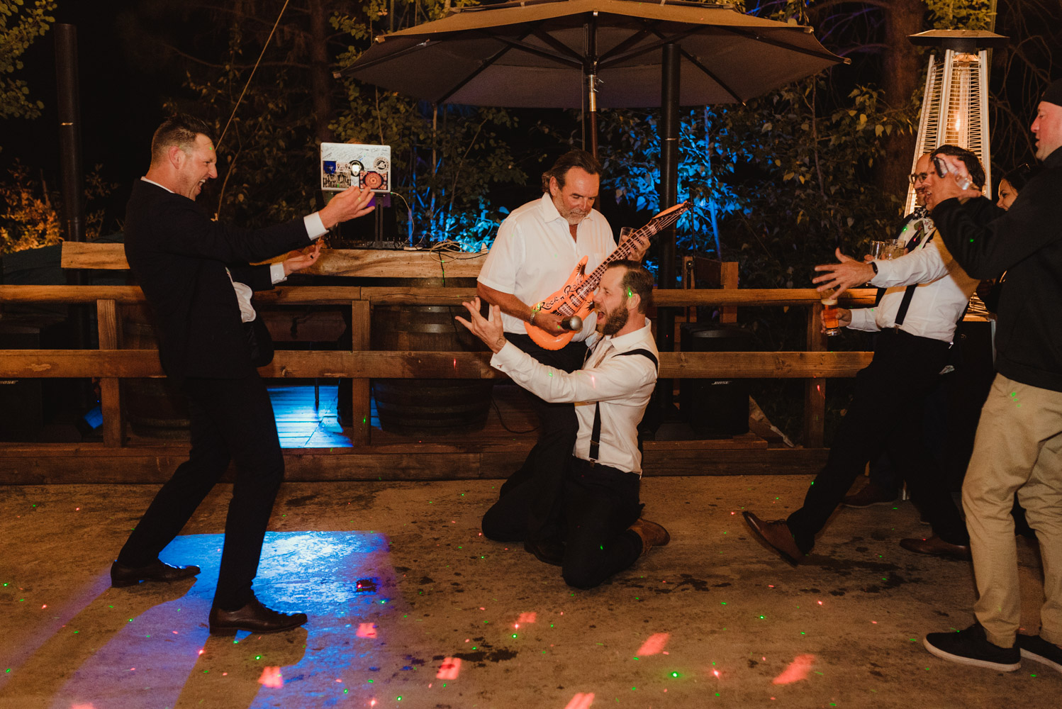 Twenty Mile House Wedding Photographer, photo of guests playing with inflatable instruments 