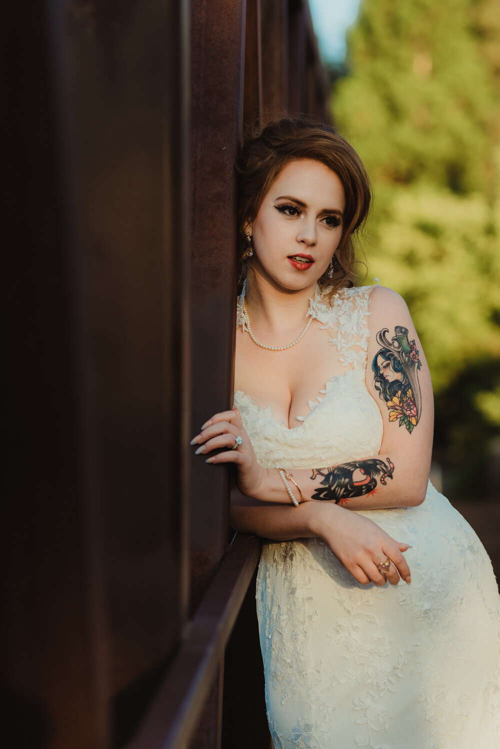 River School Farm Wedding, photo of bride leaning on a bridge