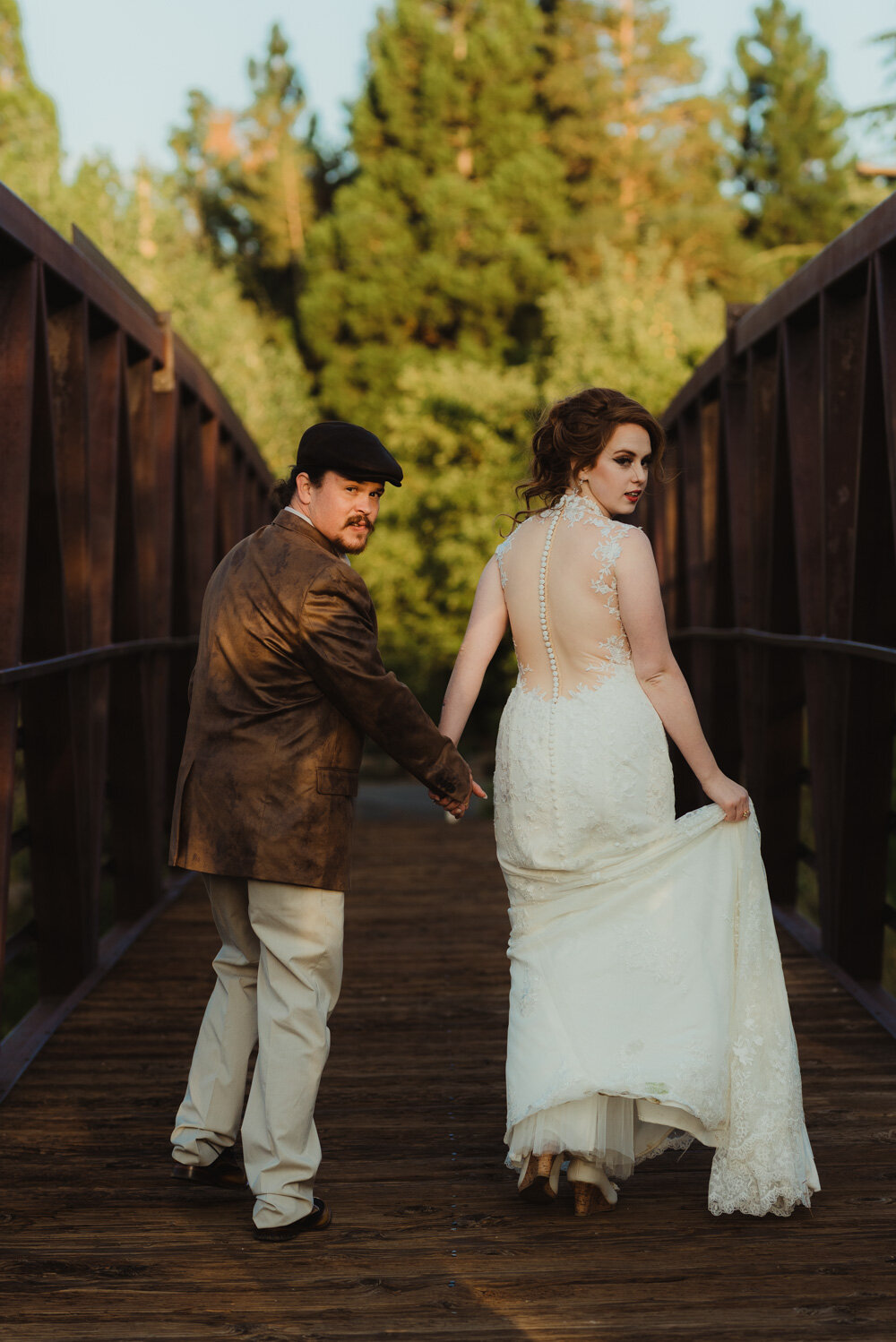 River School Farm Wedding, photo fo couple walking on a bridge 