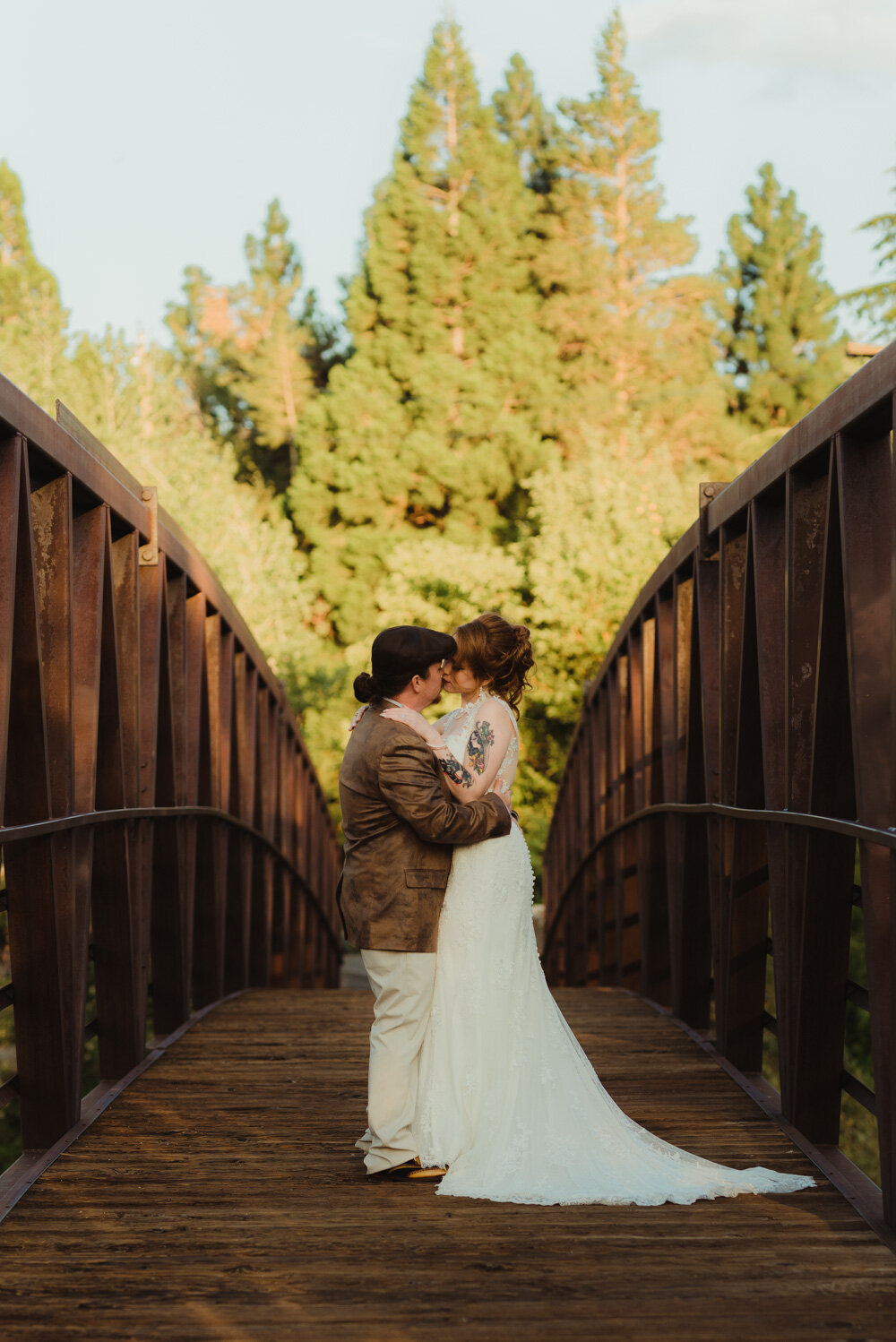 River School Farm Wedding, photo of couple standing in the middle of a bridge 