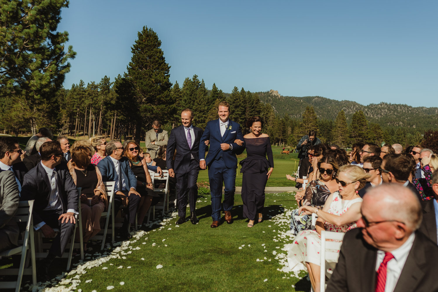 Edgewood Tahoe Wedding, groom walking down with both of his parents 