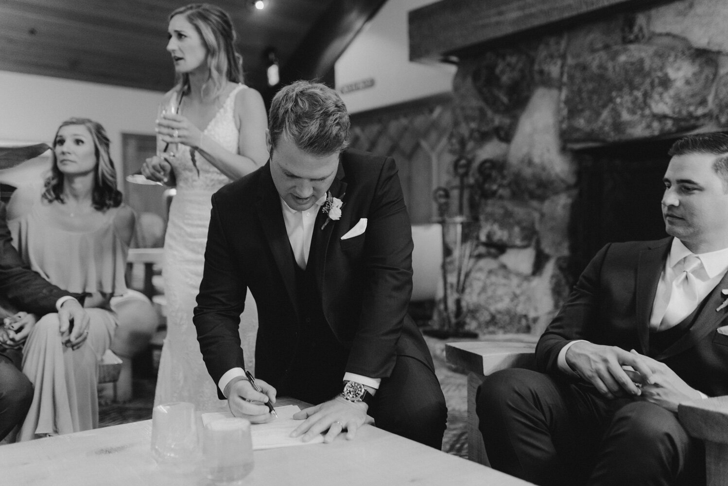 Edgewood Tahoe Wedding, photo of groom signing his marriage license 