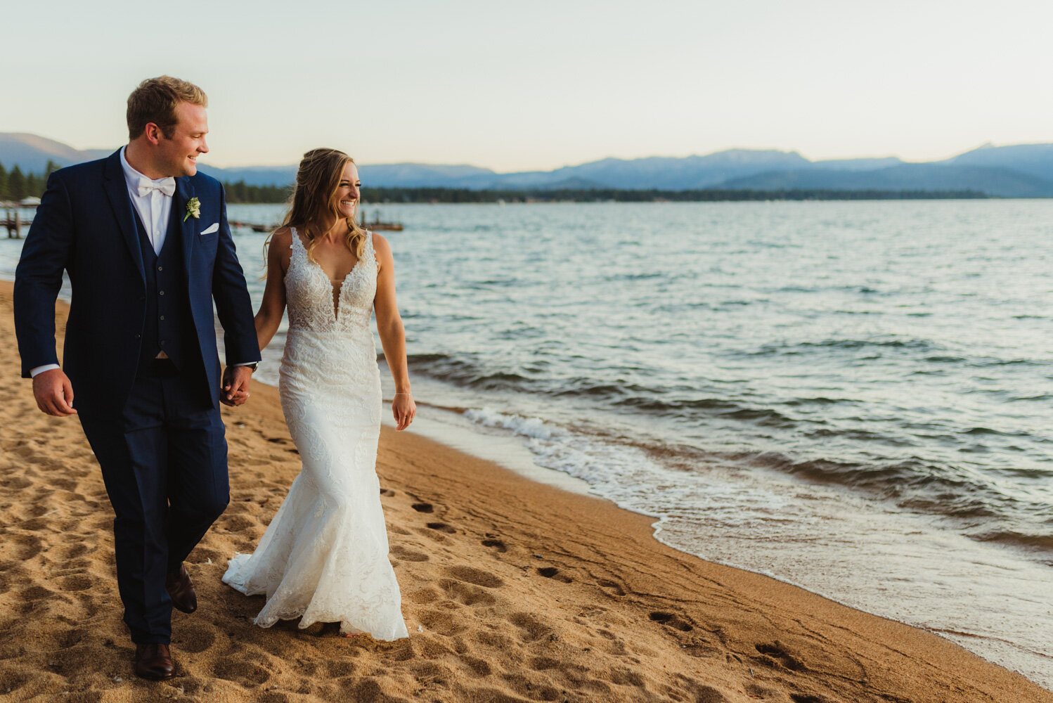 Edgewood wedding, photo of couple walking by the beach photo