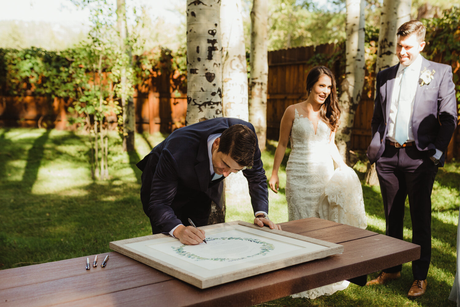 The Chateau Incline Village Wedding, photo of groom signing ketubah