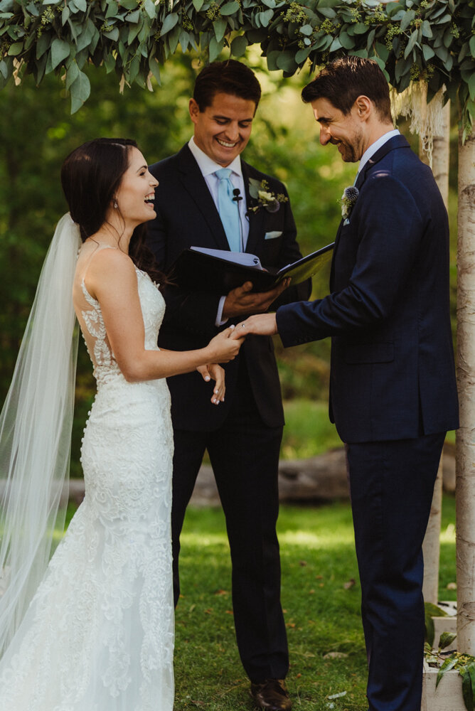 The Chateau Incline Village Wedding, photo of couple under a green arch