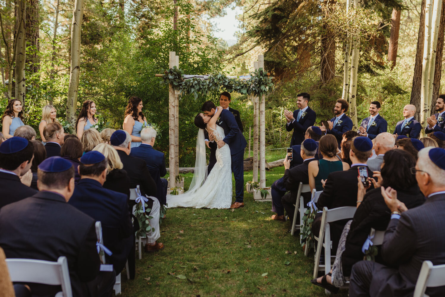 The Chateau Incline Village Wedding, photo of couples first kiss during a jewish ceremony
