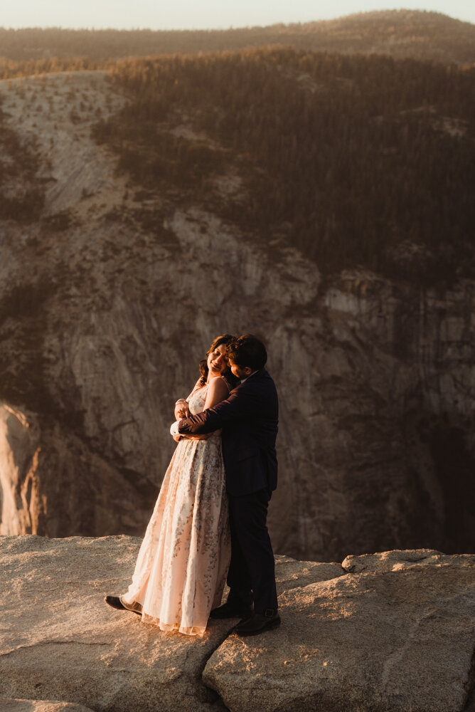 Yosemite Engagement Session, couple snuggling on taft point photo