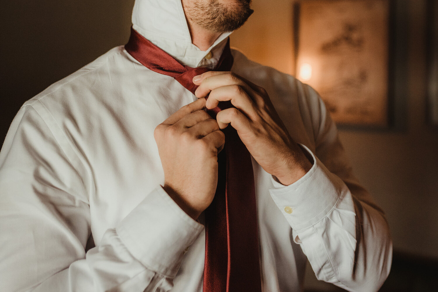 Tannenbaum Wedding Venue, photo of groom tying his tie