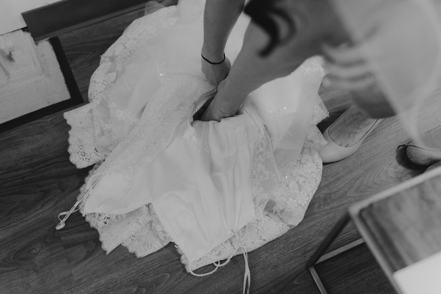 Tannenbaum Wedding Venue, photo of bride putting on her dress