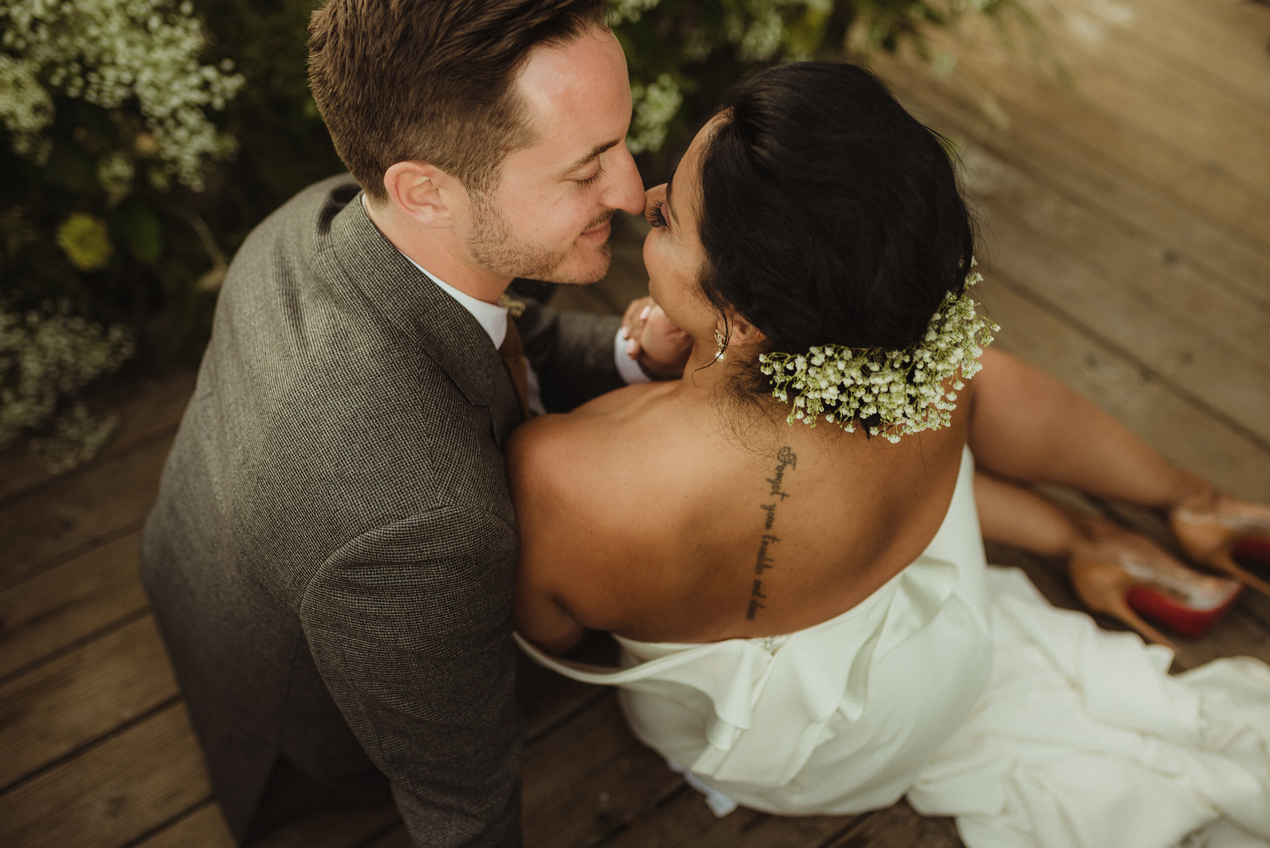 lake tahoe elopement, couple sitting on the dock photo