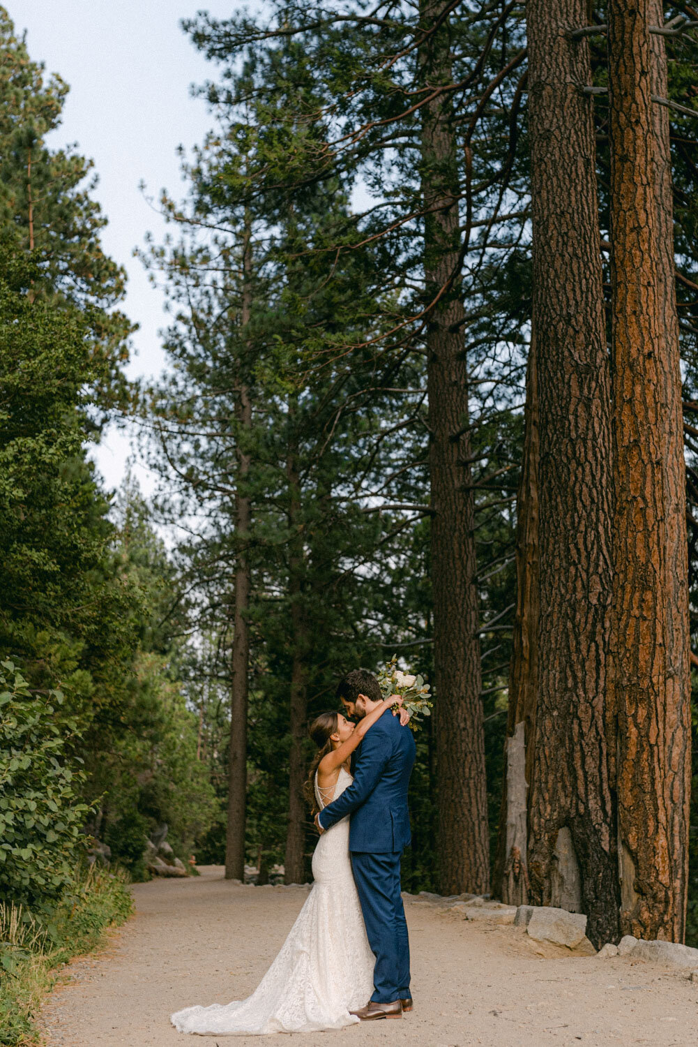 COVID Wedding in Lake Tahoe, wide angle photo of couple in the forest
