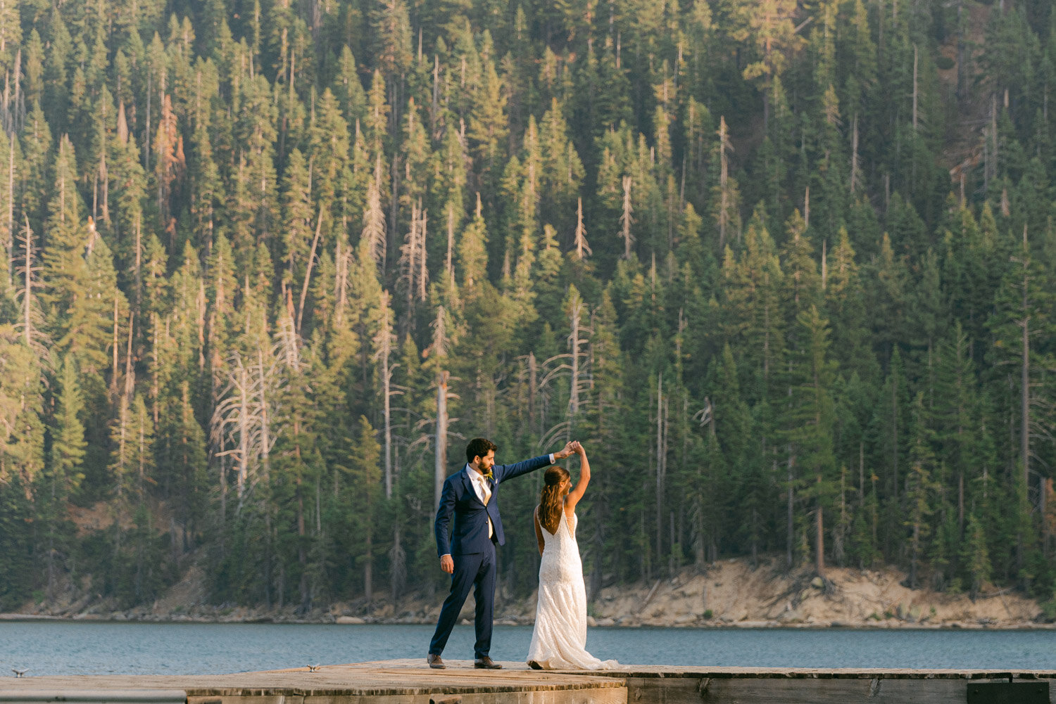 COVID Wedding in Lake Tahoe, couple dancing on a dock at emerald bay