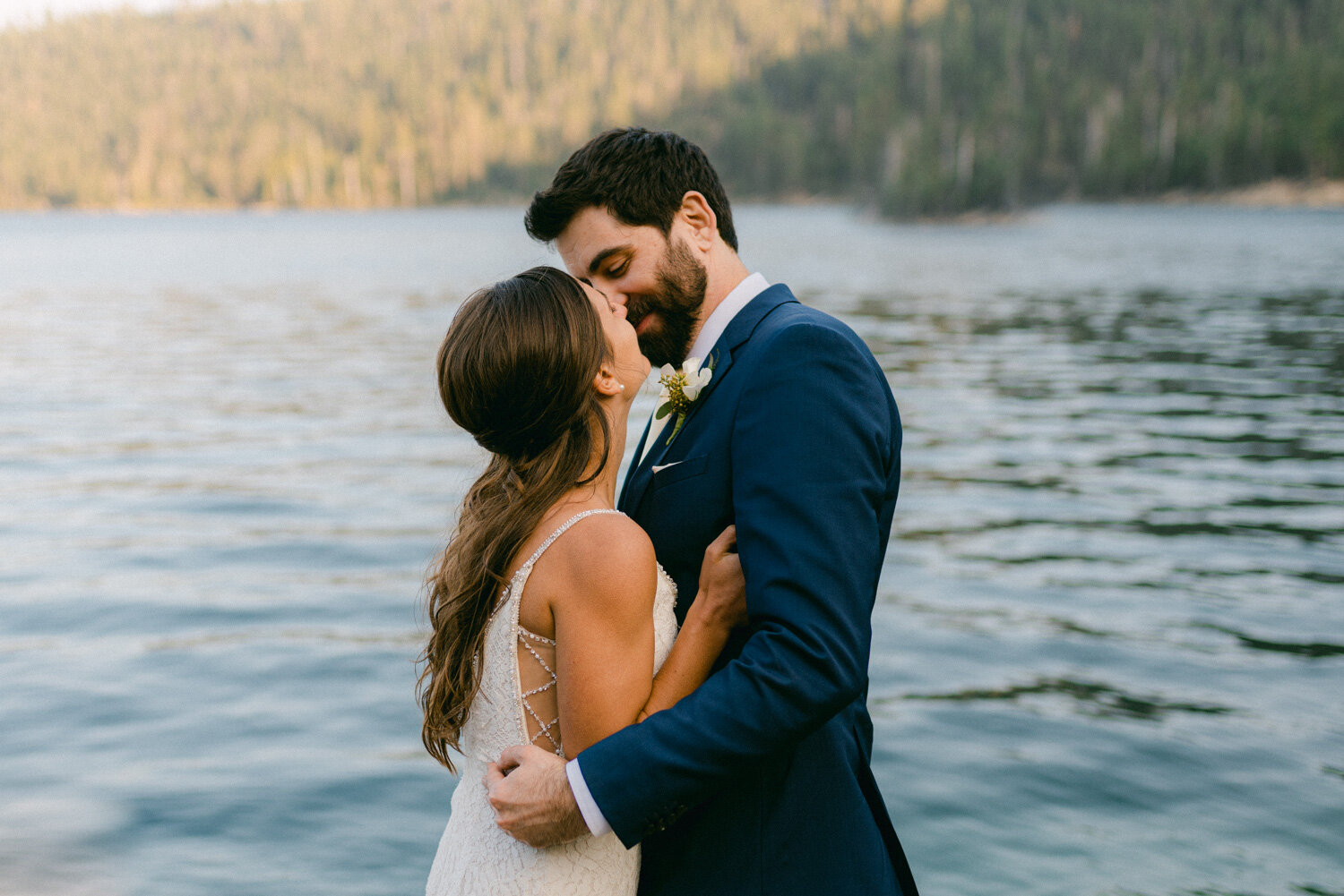 COVID Wedding in Lake Tahoe, couple kissing at the beach near emerald bay