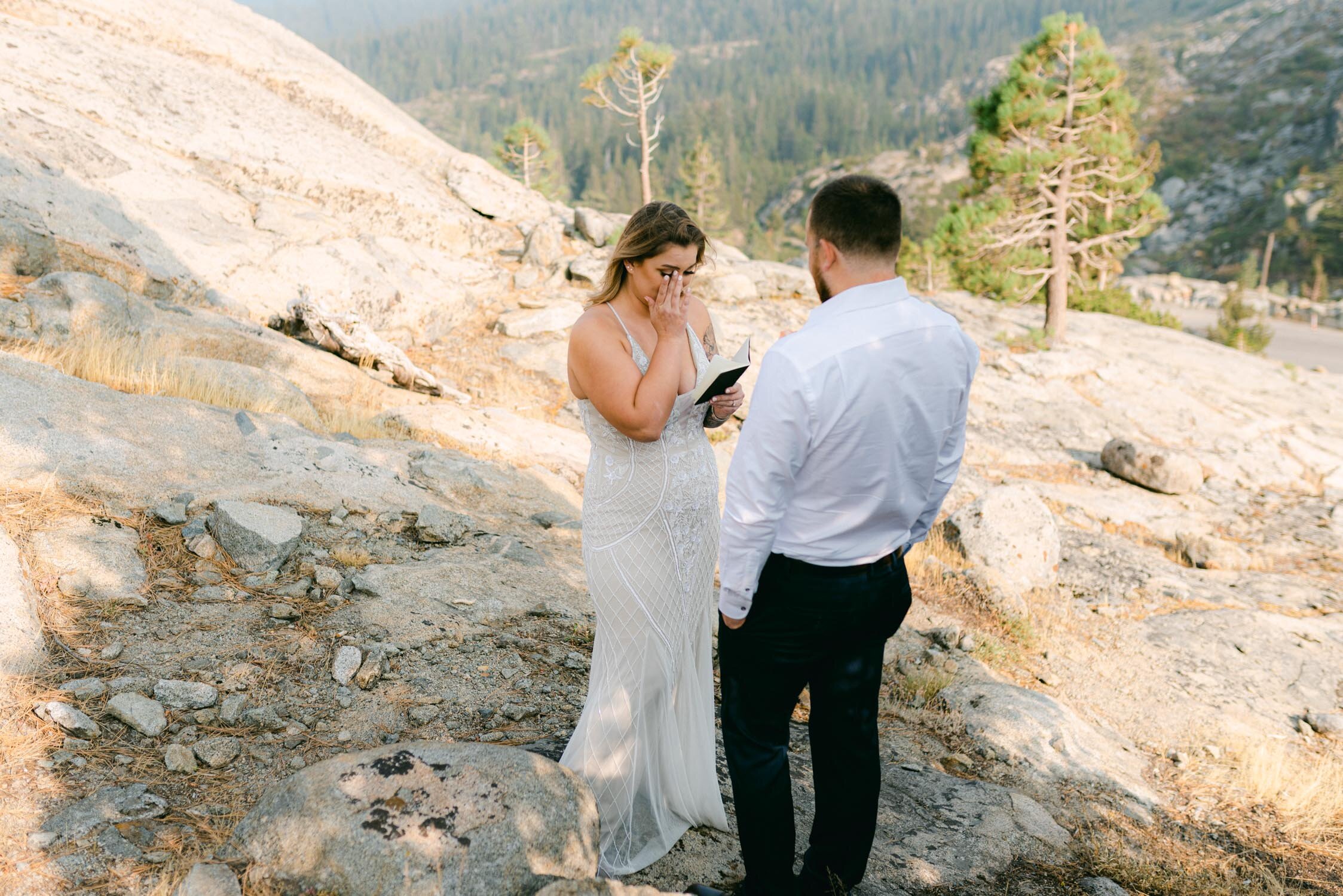 Donner Lake Elopement, photo of bride reading vows before the ceremony photo