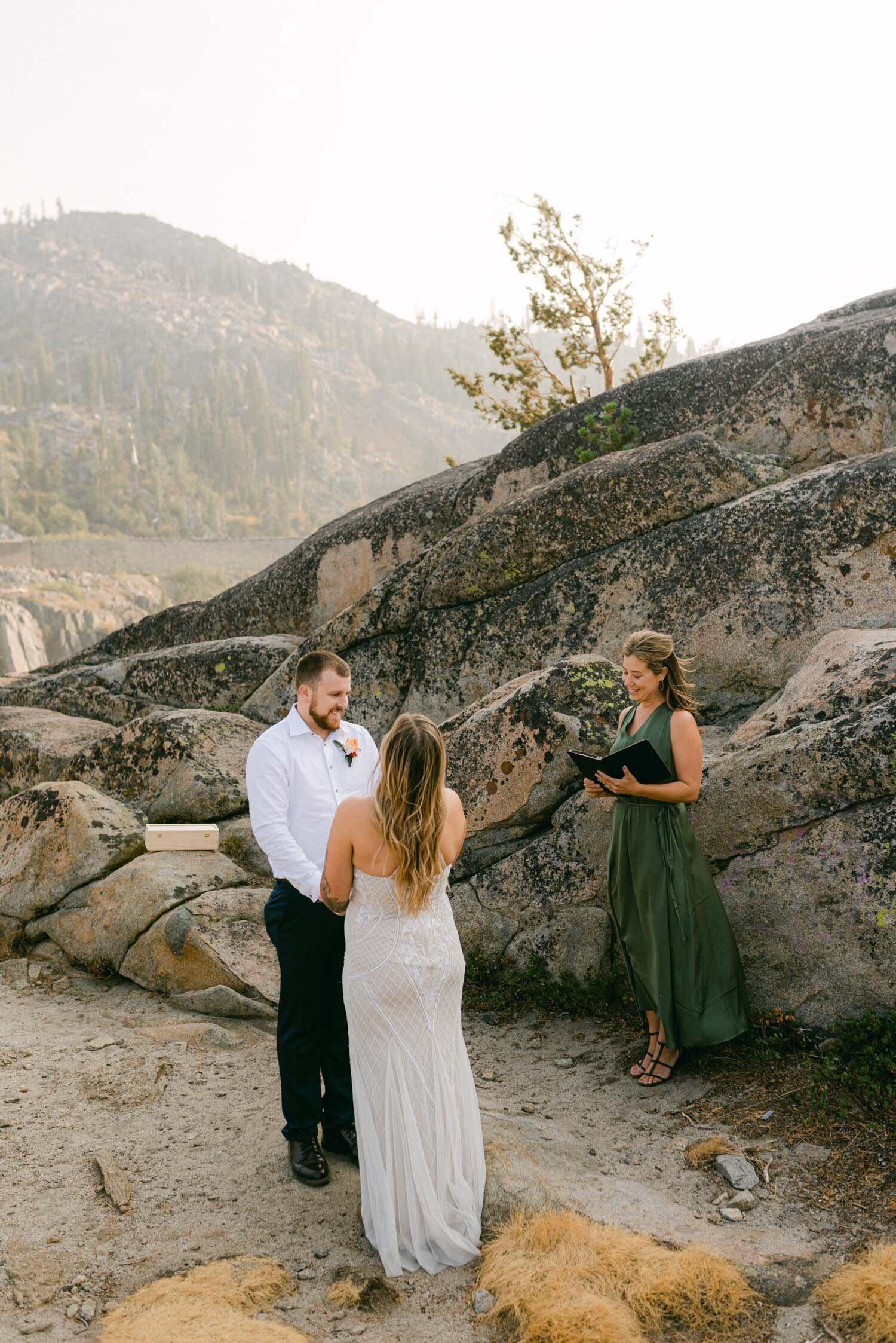 Donner Lake Elopement, photo of couple holding a wine box with letters