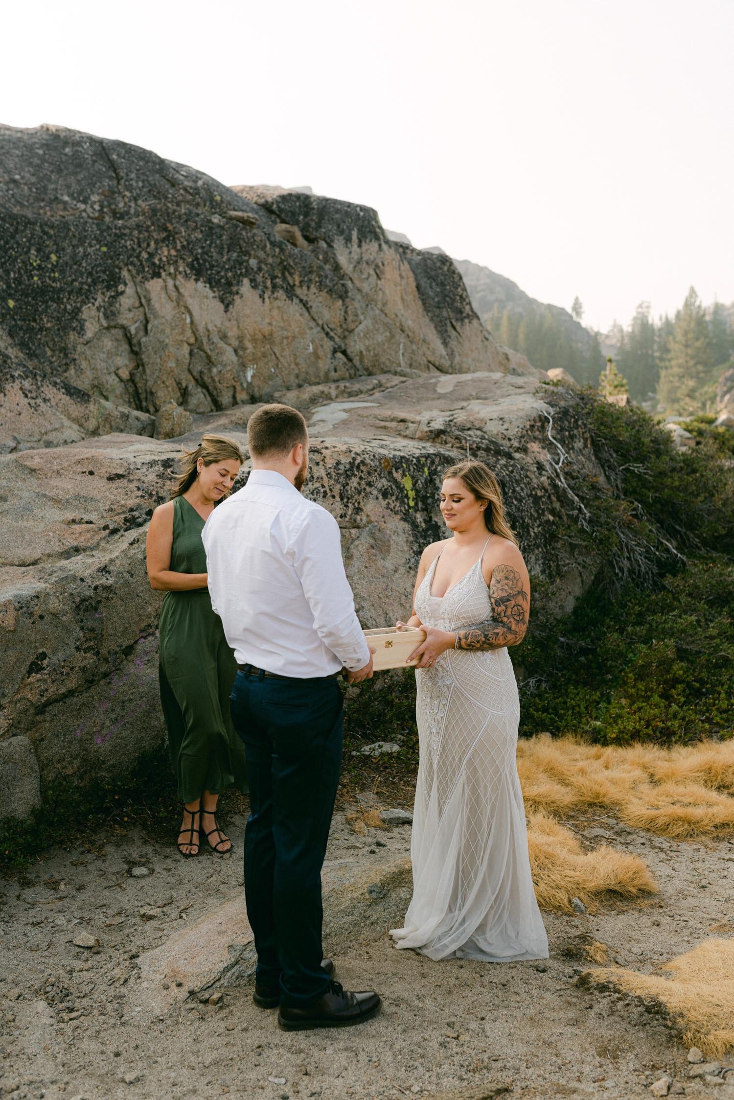 Donner Lake Elopement, photo of bride holding a wine box during the ceremony
