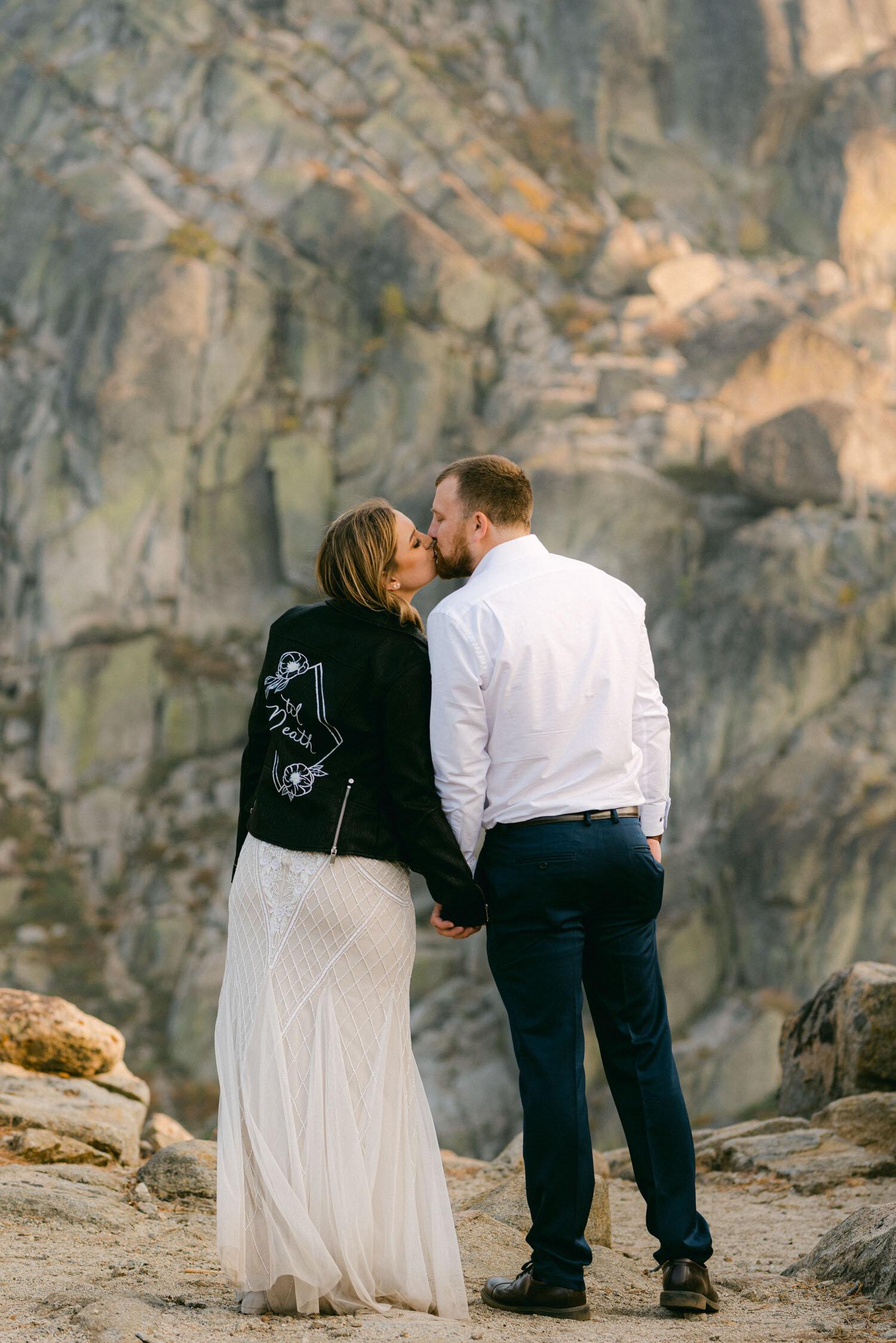 Donner Lake elopement, photo of bride wearing a "til death" wedding leather jacket