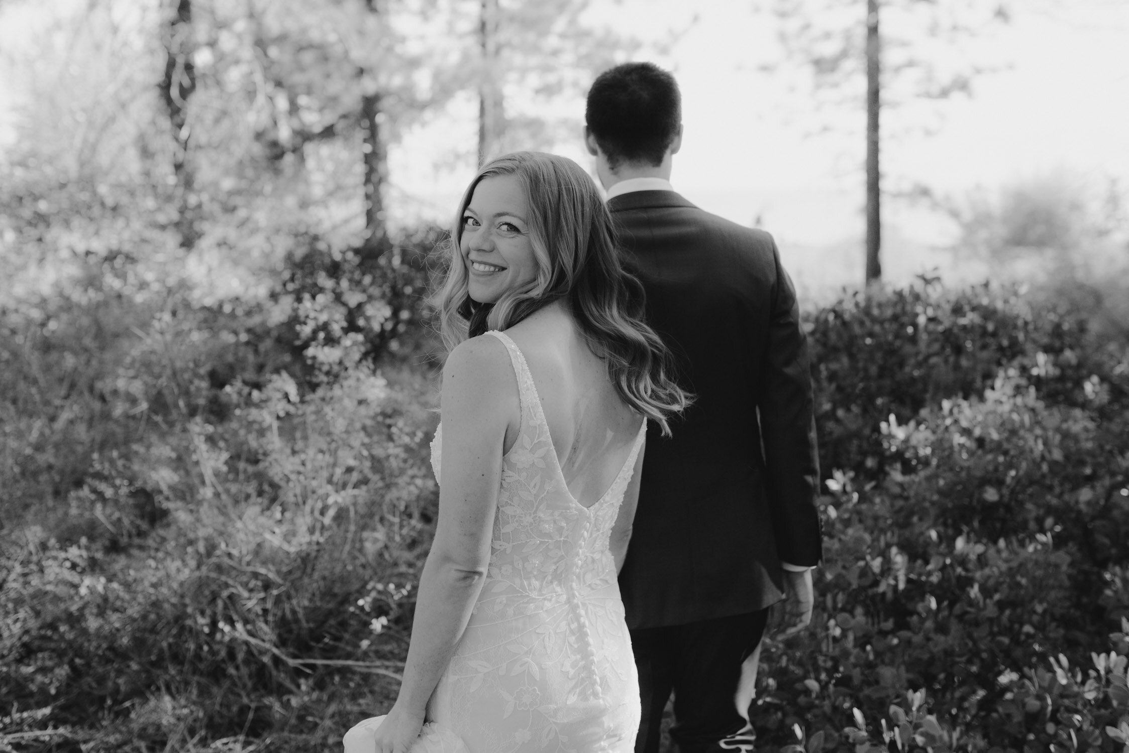 Fall Lake Tahoe wedding, photo of bride looking over her shoulder