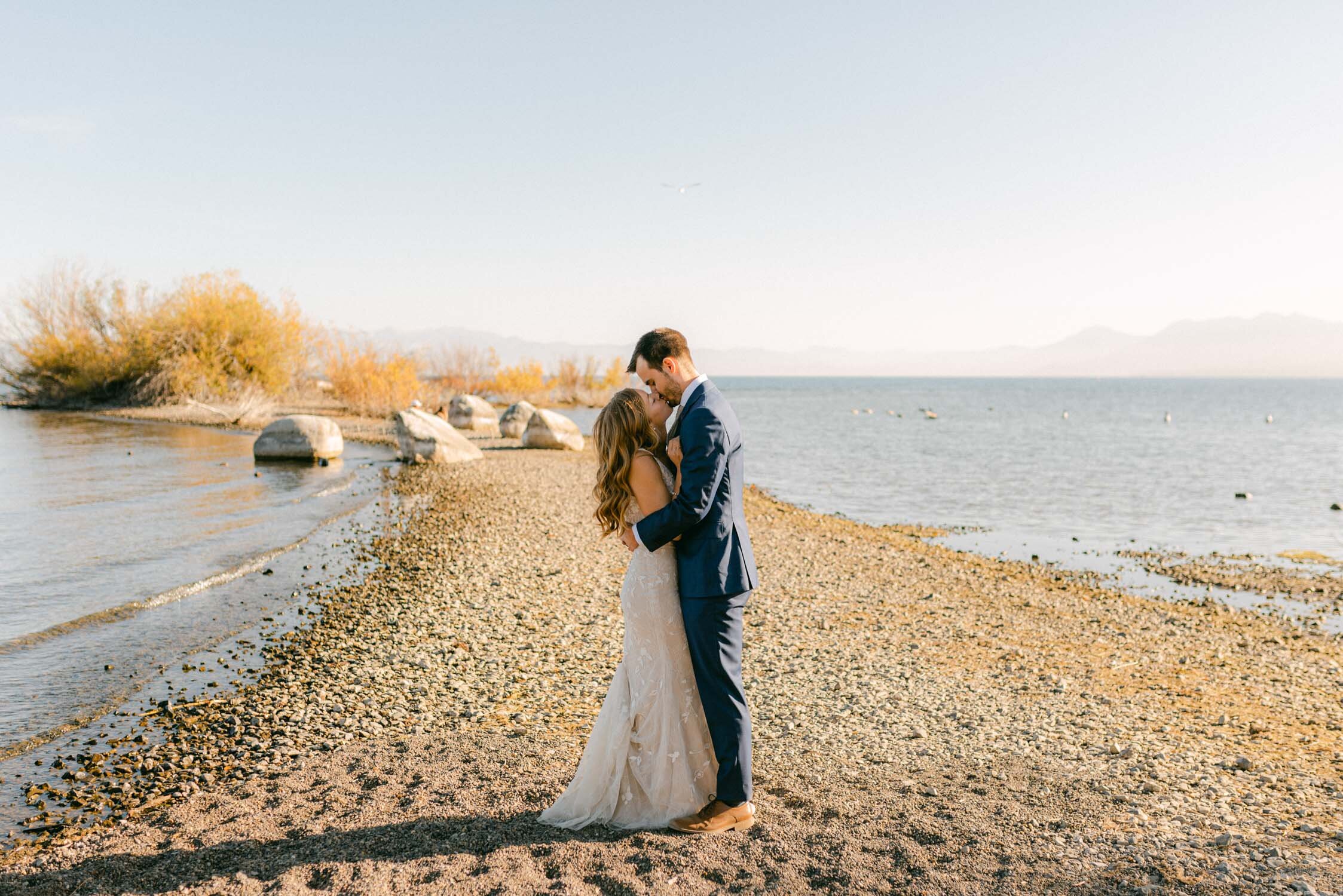 Fall Lake Tahoe wedding, photo of couple on a lake peninsula 