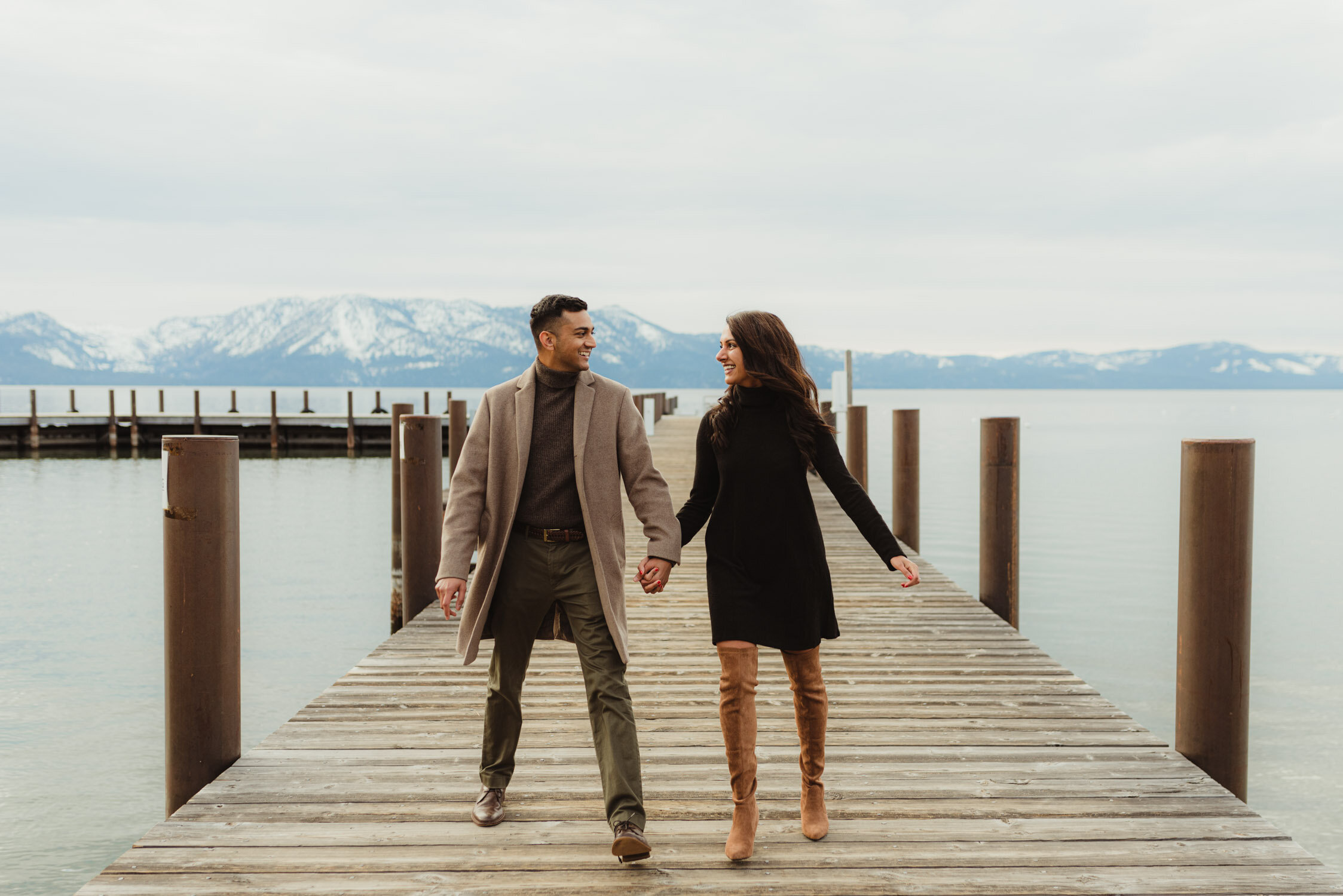 Lake Tahoe Proposal, photo of couple holding hands on a dock