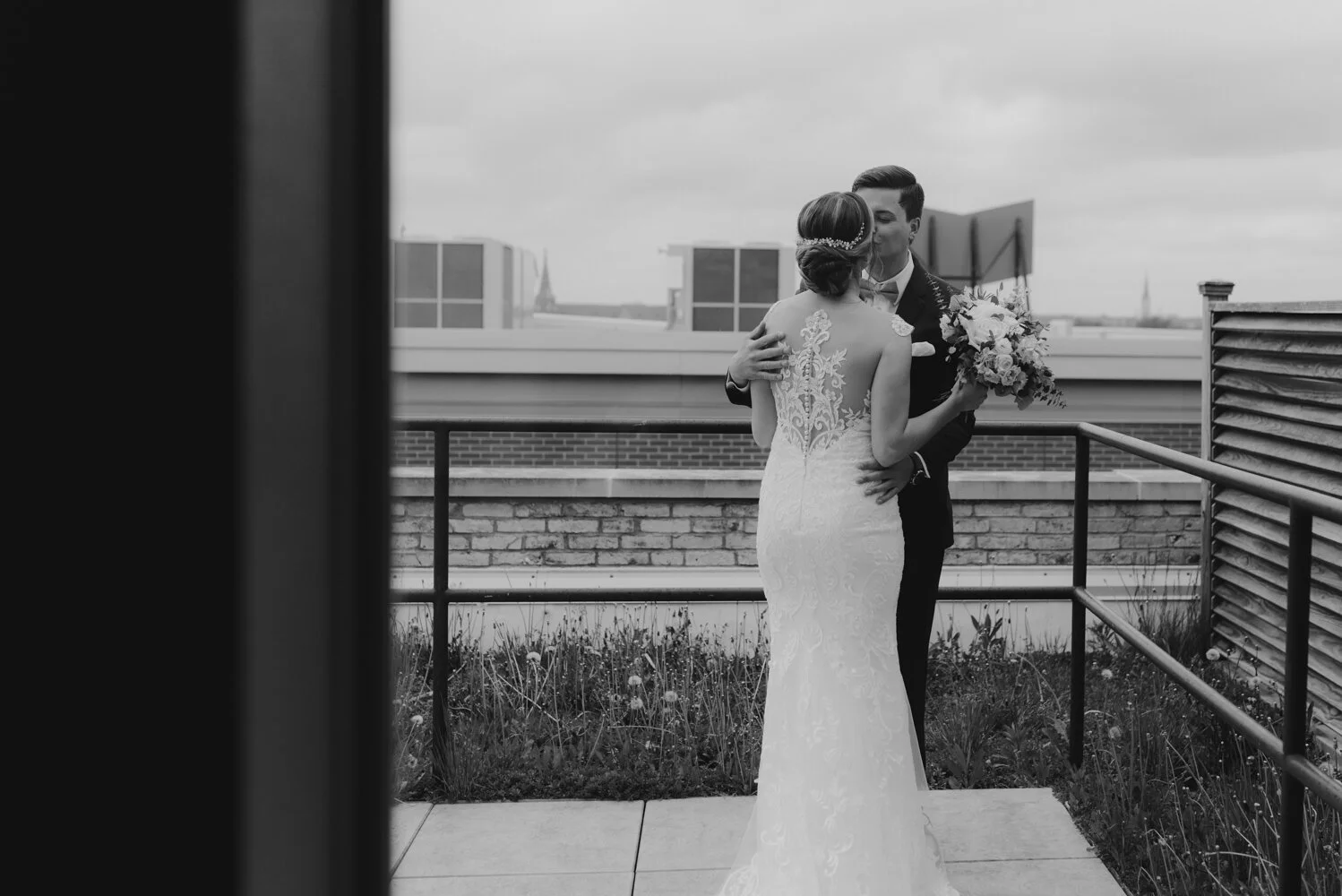Best Place at Historic Pabst Brewery Wedding, photo of couple sneaking in a kiss