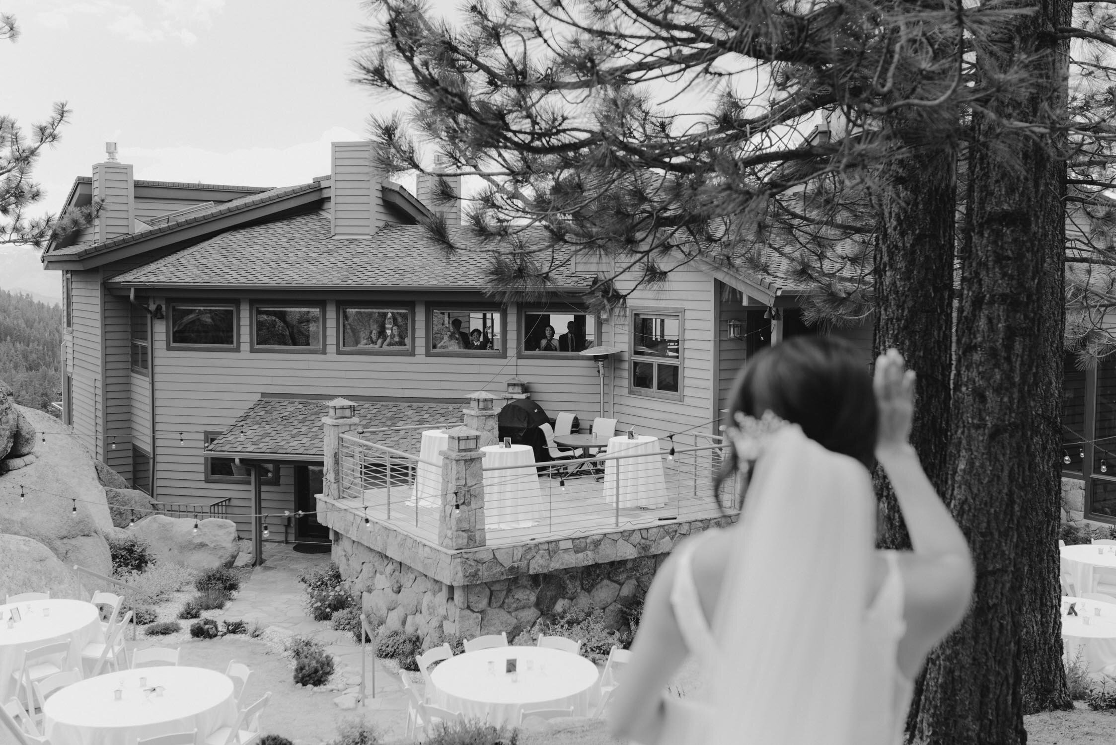 Tahoe Blue Estate Wedding photo of bride waiving at her guests