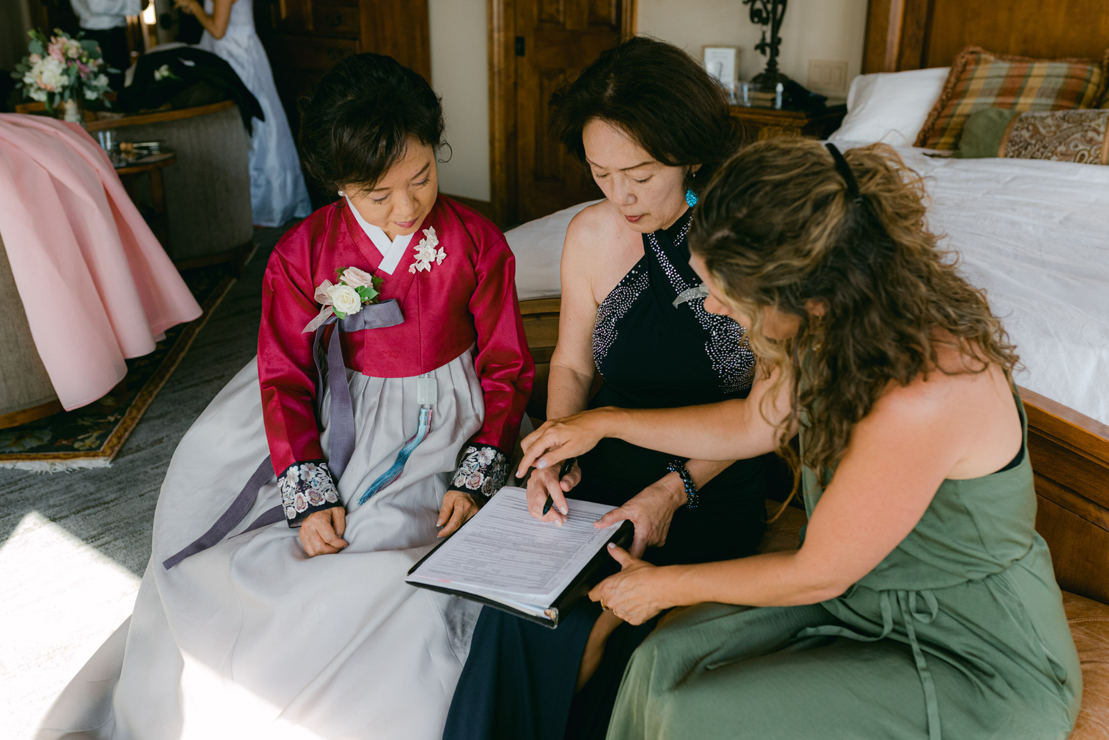 Tahoe Blue Estate Wedding, photo of moms signing the marriage license 