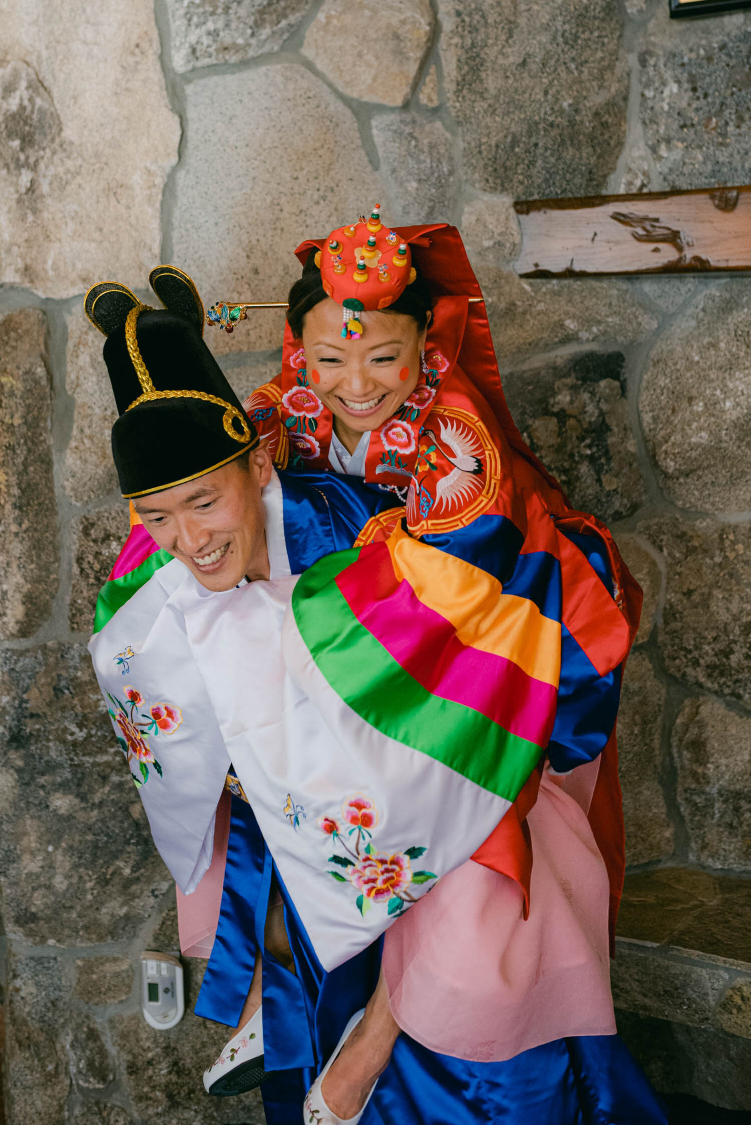 Tahoe Blue Estate Wedding, photo the groom carrying the bride during the Korean and Chinese wedding ceremony