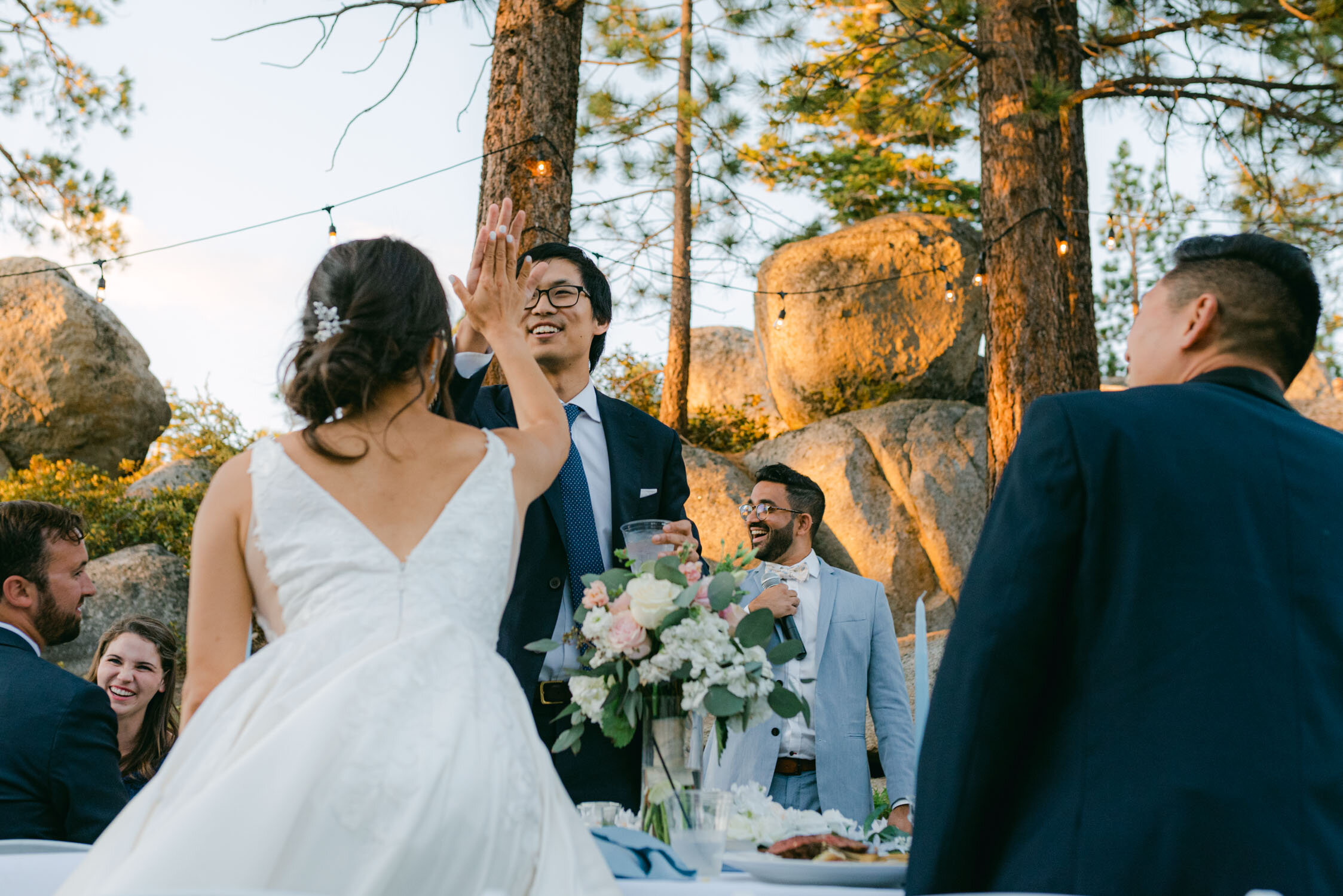 Tahoe Blue estate wedding photography, photo of bride high-fiving 