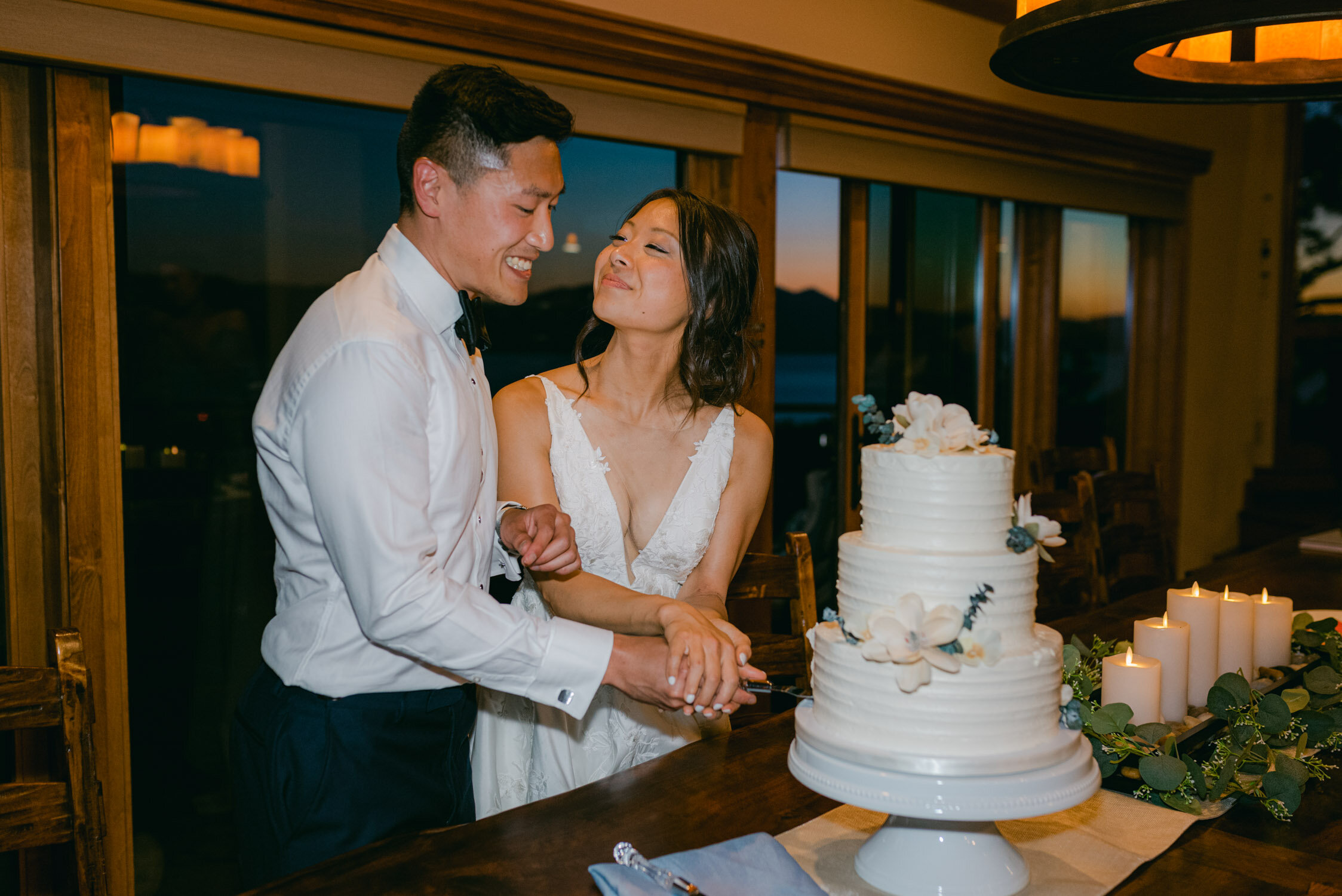 Tahoe Blue Estate Wedding Reception Photo, couple cutting the cake