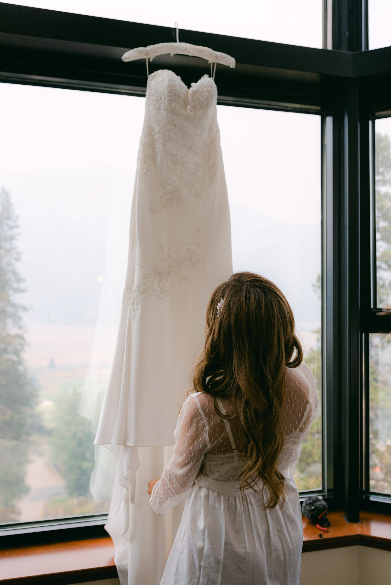 Palisades Wedding, photo of bride looking at her wedding dress