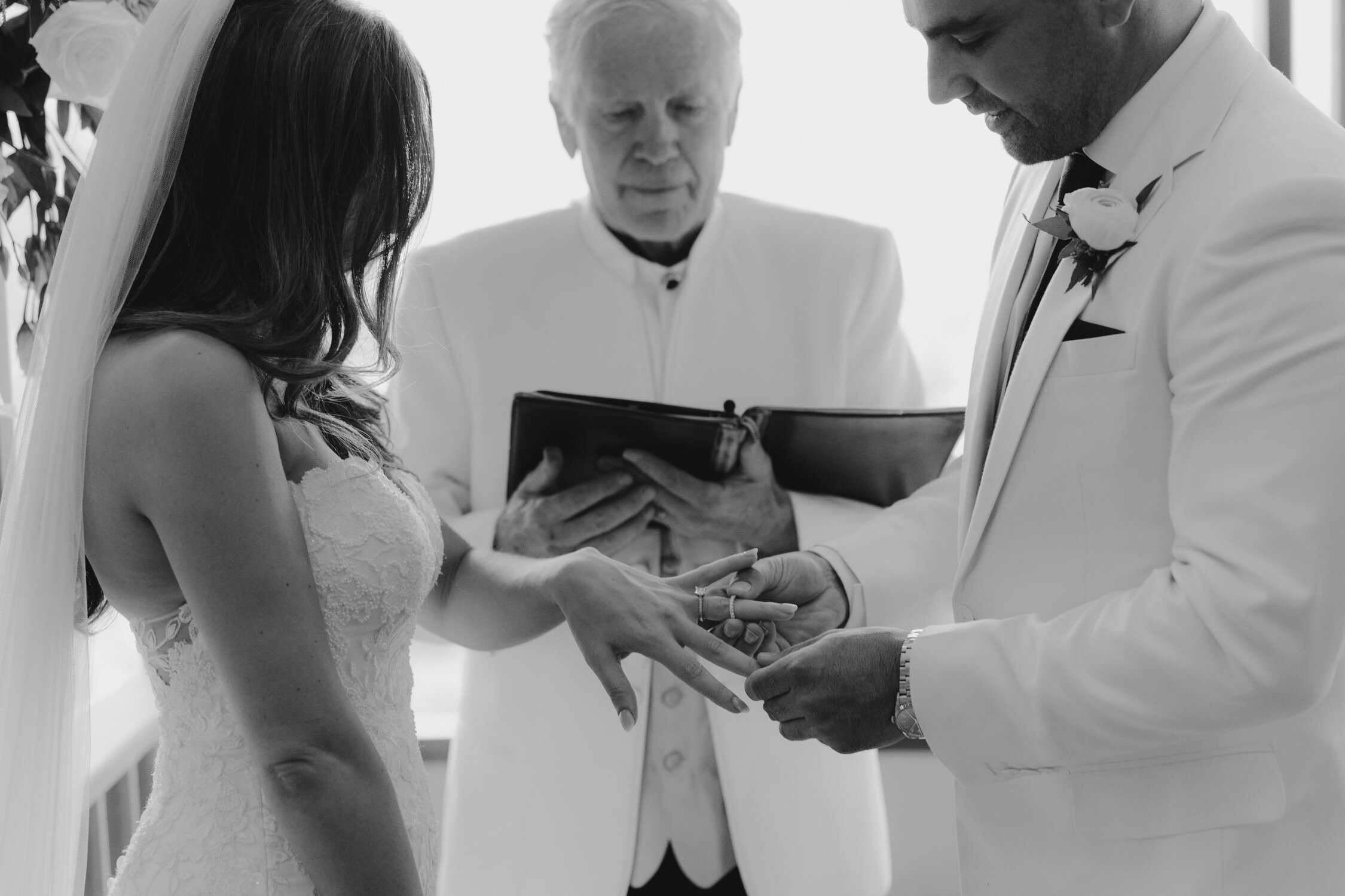Palisades wedding, photo of couple putting on their wedding bands
